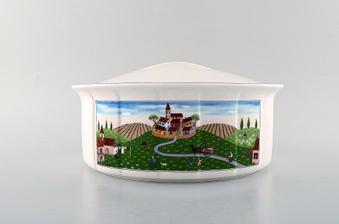 Villeroy & Boch Naif dinner service in porcelain. Oval lidded tureen decorated with naivist village motif.
In very good condition.
Stamped.
Measures: 25 x 11.5 cm.
Designed by Gérard Laplau. Motives of families, villages and biblical scenes in