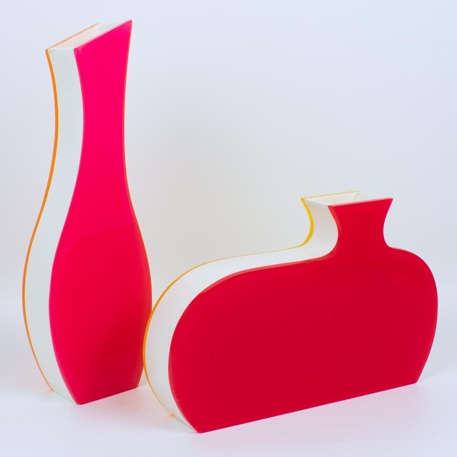 Villeroy & Boch produced that stunning pair of vases in the 1990s. This playful design is modern with an incredible color combination. Each vase has a multilayer sandwich shape of Acrylic, Lucite, or Plexiglass in white, yellow, orange, neon red,
