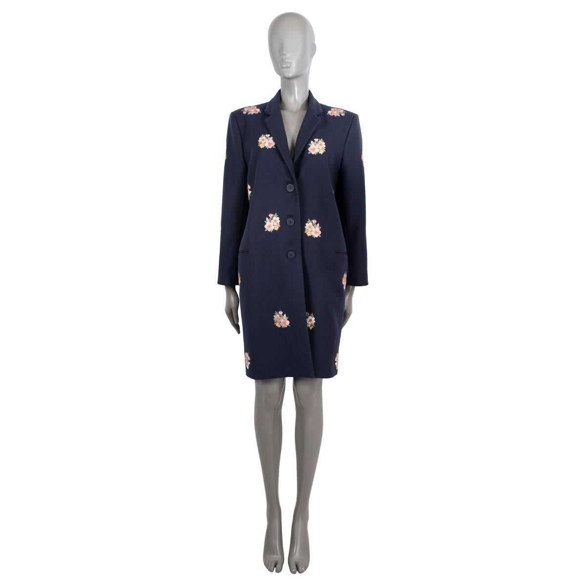 100% authentic Vilshenko coat in midnight blue virgin wool (100%). Features multicolor floral embroidery through-out, notched lapels and two welt pockets on the front. Opens with three buttons on the front. Lined in midnight blue viscose (59%) and
