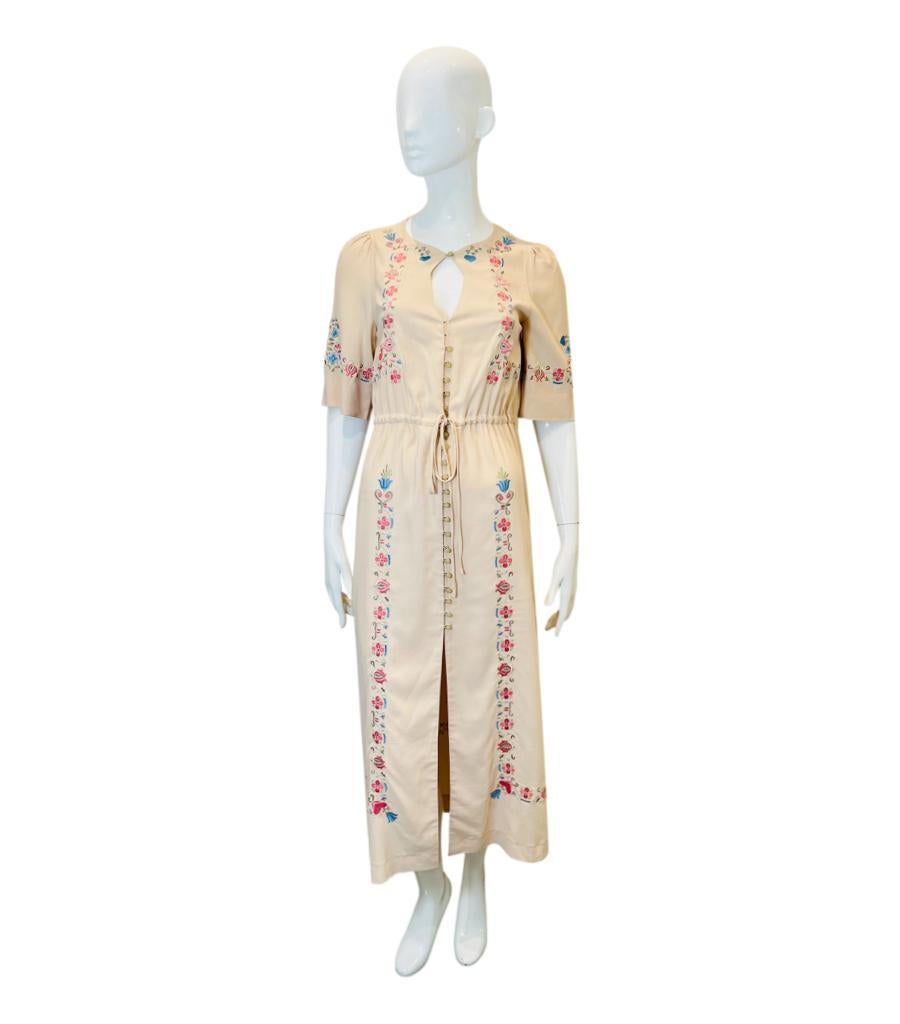 Vilshenko Silk Embroidered Dress
Ivory dress designed with multicoloured vintage folk embroidery.
Detailed with button closure along the centre and key drop neckline.
Featuring loose short sleeves and drawstring waist.
Size – M (Label missing but