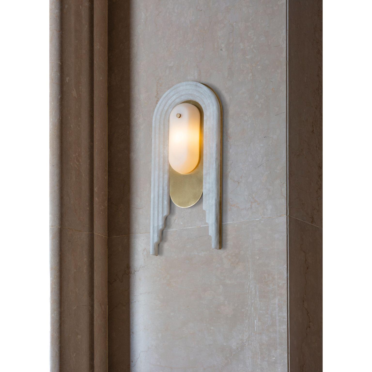 Vima wall light by Bert Frank
Dimensions: D17.6 x W4.7 x H39.2 cm
Materials: Brass, Alabaster, Glass

Finishes: Brushed brass lacquered as standard, Alabaster facade
IP rating, IP20 rated, suitable for outside wet area zones
Light source. 1x