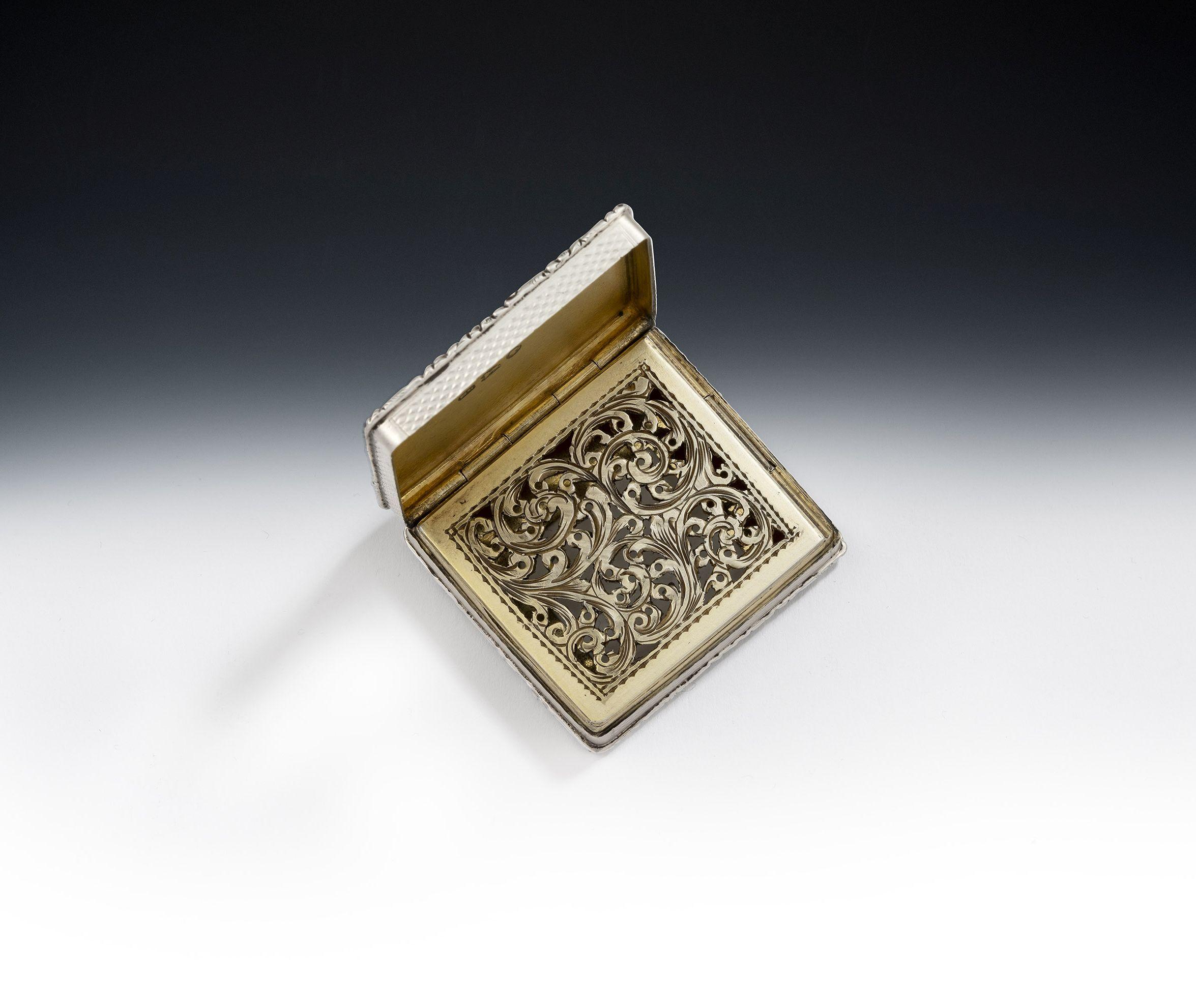 A very fine & unusual cased vinaigrette made in Birmingham in 1845 by Edward Smith

This exceptional example is modelled in an unusual, almost square, form with a cast foliate frame on the cover and the base.  Both the base, sides and cover are