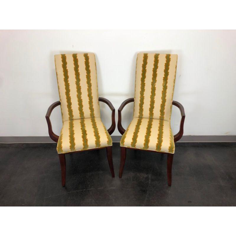 A striking pair of armchairs in the Transitional style by Charles Stewart. Made in Hickory, North Carolina, USA circa 1990s. Mahogany frames.

 Measures:  Overall: 26 W 27 D 46 H, Seats: 19 W 18 D 19.5 H, Arms: 27.5 H

Very good vintage condition.