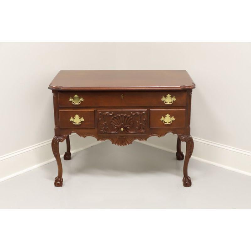 A Chippendale style lowboy chest by high-quality furniture maker Craftique. Solid mahogany with their Mellowax finish, brass hardware, ogee edge to the top, carved apron & knees, cabriole legs and ball in claw feet. Features one upper over three