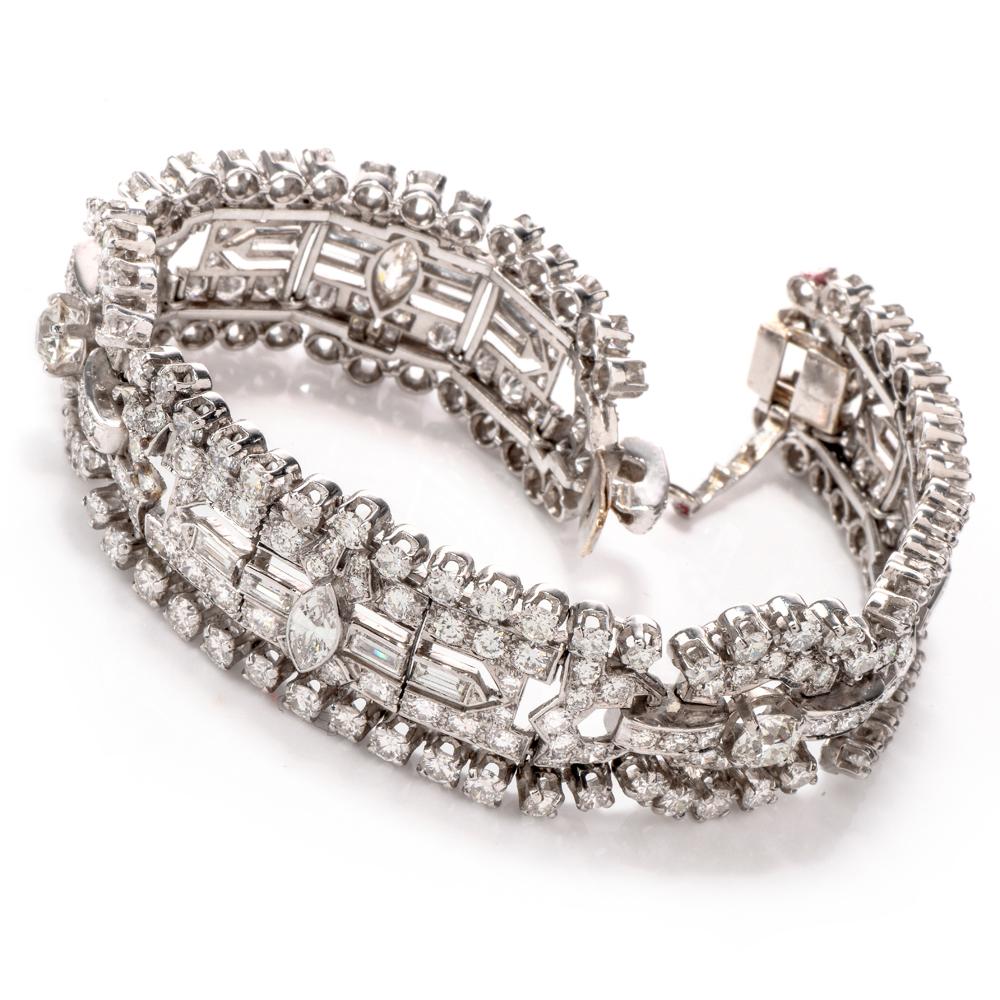 This 1950's vintage  diamond link bracelet is crafted in solid platinum.
It incorporates three quintessentially Art Deco elongated rectangular plaques with subtly rounded corners, exposing 2 larger European-cut round diamonds and 3 marquise-cut