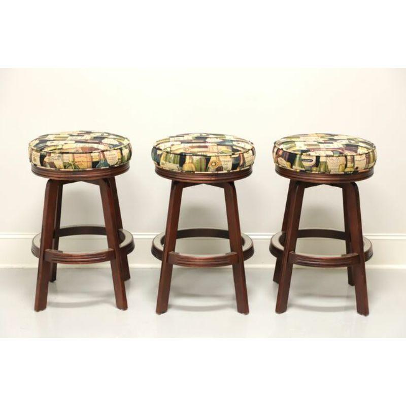 A set of three Contemporary style gameroom barstools by Mikhail Darafeev, their 438 Bartender Stool. Maple with brass accents to round foot rest and angular straight legs. Features a round wines motif fabric upholstered padded swivel seat. Made in