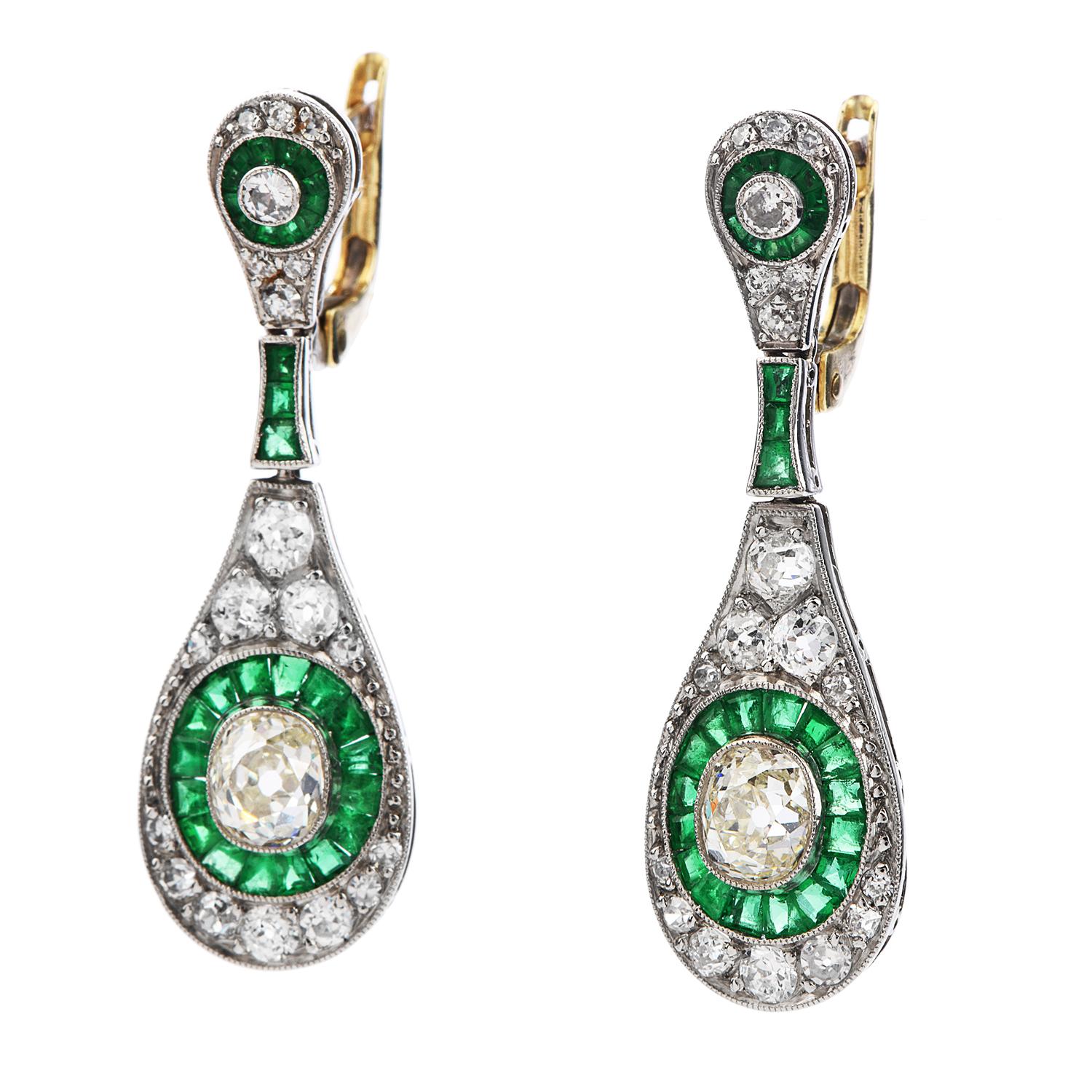 Be stunning with these Diamond & Emerald Platinum  Drop Dangle Earrings!  

These vinatge earrings are crafted in platinum and weigh in a total of 6.0 grams and measure 30mm long by 10 millimeters wide.  

There are 2 genuine old