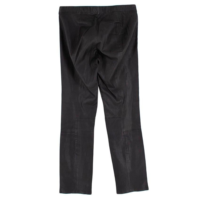 Vince Black Leather Trousers 

- Elasticated waistband 
- Tailored with paneling for a streamlined look
- Cropped above ankle

Materials:
- 100% Leather 

Professional clean only by leather expert

Made in China 
Measurements are taken laying flat,