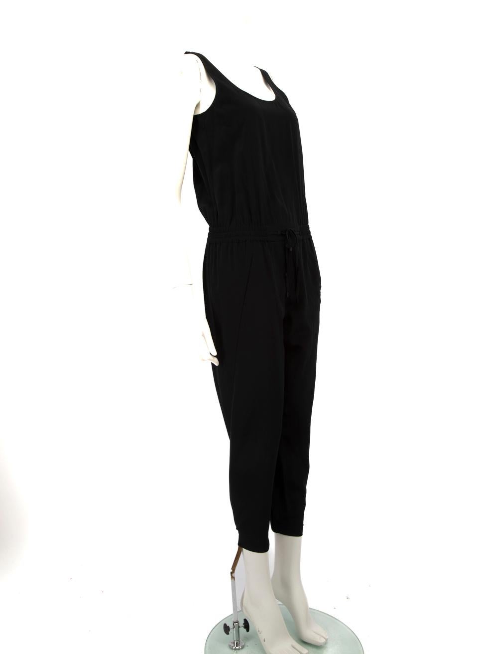 CONDITION is Very good. Minimal wear to the jumpsuit is evident, there is overall discolouration on the lining of the jumpsuit mainly on the the inner and outer shoulder straps, the internal waistband and lining around the leg cuffs of this used