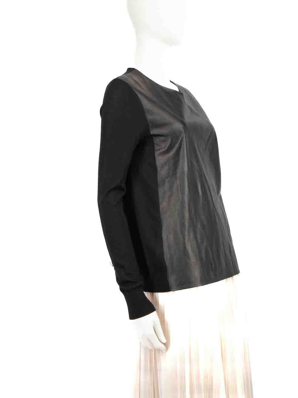 CONDITION is Very good. Minor wear to top is evident. There is a pluck to the weave on the right side sleeve near the knitted cuff on this Vince designer resale item.
 
 Details
 Black
 Wool
 Top
 Long sleeves
 Round neck
 Front leather panel
 Round