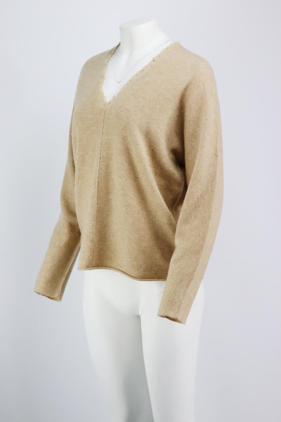 This sweater by Vince is perfect for transitioning between seasons, this knitted style has a v-neckline with fringed trim and a relaxed, loose fit. Beige cashmere. Slips on. 100% Cashmere. Size: Medium (UK 10, US 6, FR 38, IT 42). Bust measures