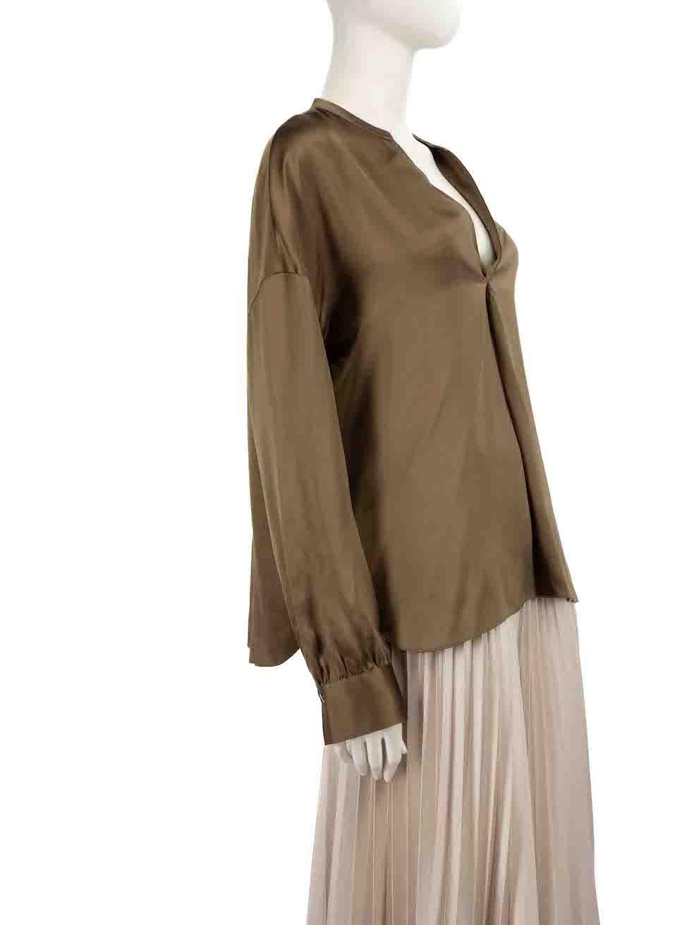 CONDITION is Very good. Hardly any visible wear to blouse is evident on this used Vince designer resale item.
 
 Details
 Khaki
 Silk
 Blouse
 V-neck
 Long sleeves
 Buttoned cuffs
 
 
 Made in China
 
 Composition
 100% Silk
 
 Care instructions: