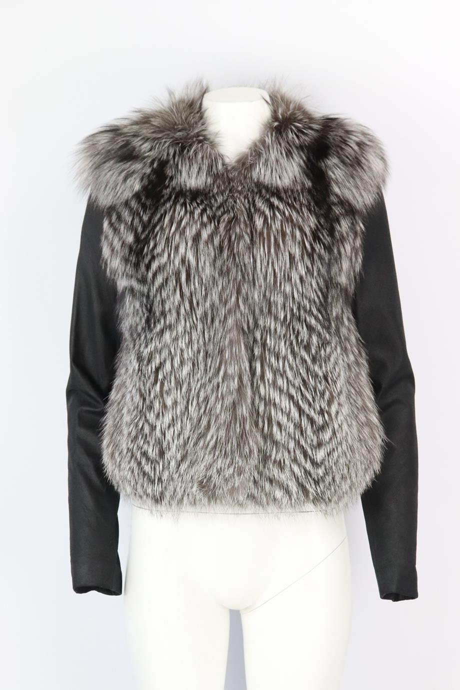 Vince leather trimmed fox fur jacket. Grey and black. Long sleeve, crewneck. Hook and eye fastening at front. 100% Silver fox fur; fabric2: 100% lambs leather; lining: 100% polyester. Size: Medium (UK 10, US 6, FR 38, IT 42). Shoulder to shoulder: