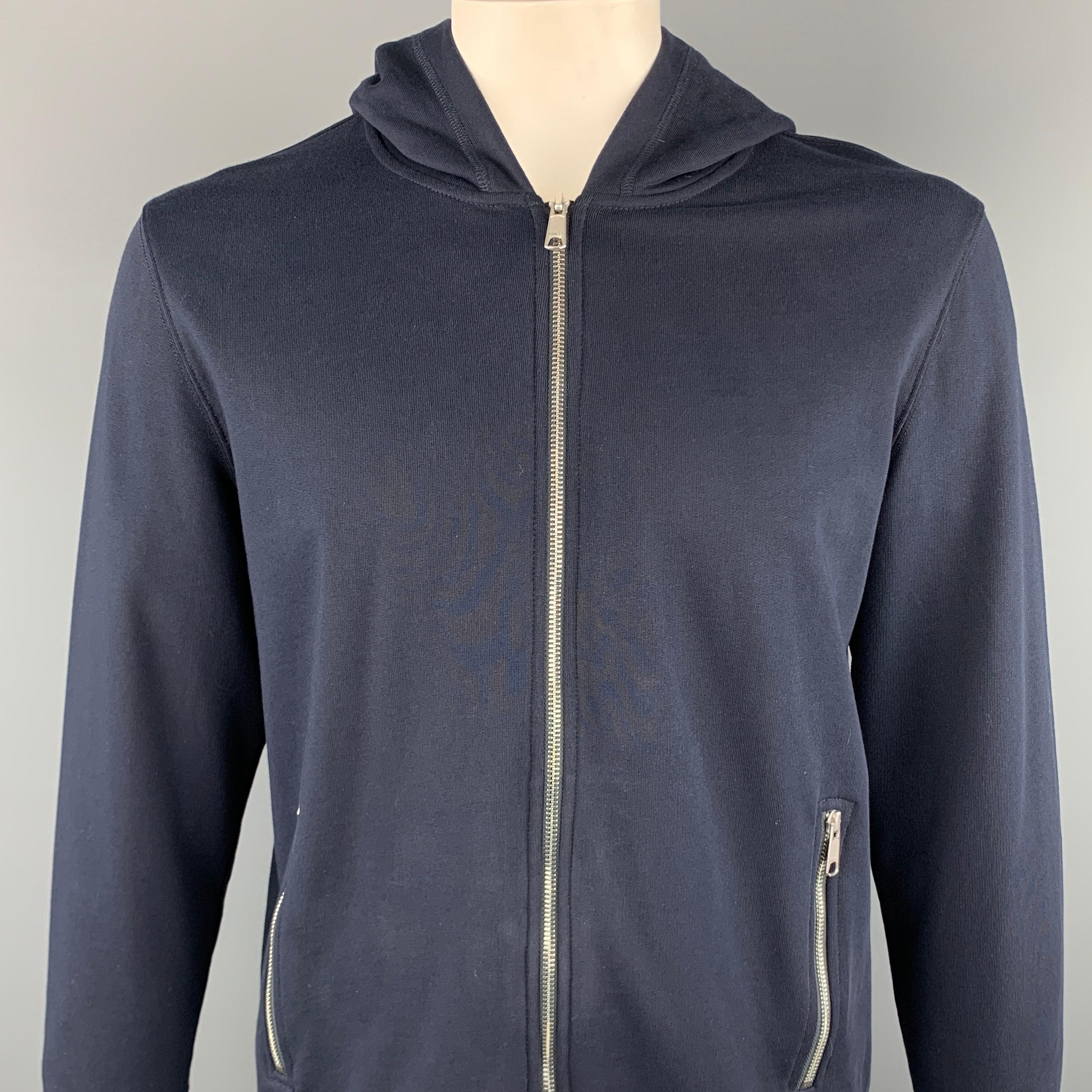 VINCE jacket comes in a navy cotton featuring a hooded style, zipper pockets, and a full zip closure. 

Excellent Pre-Owned Condition.
Marked: L

Measurements:

Shoulder: 20 in.
Chest: 46 in. 
Sleeve: 28 in. 
Length: 27 in. 