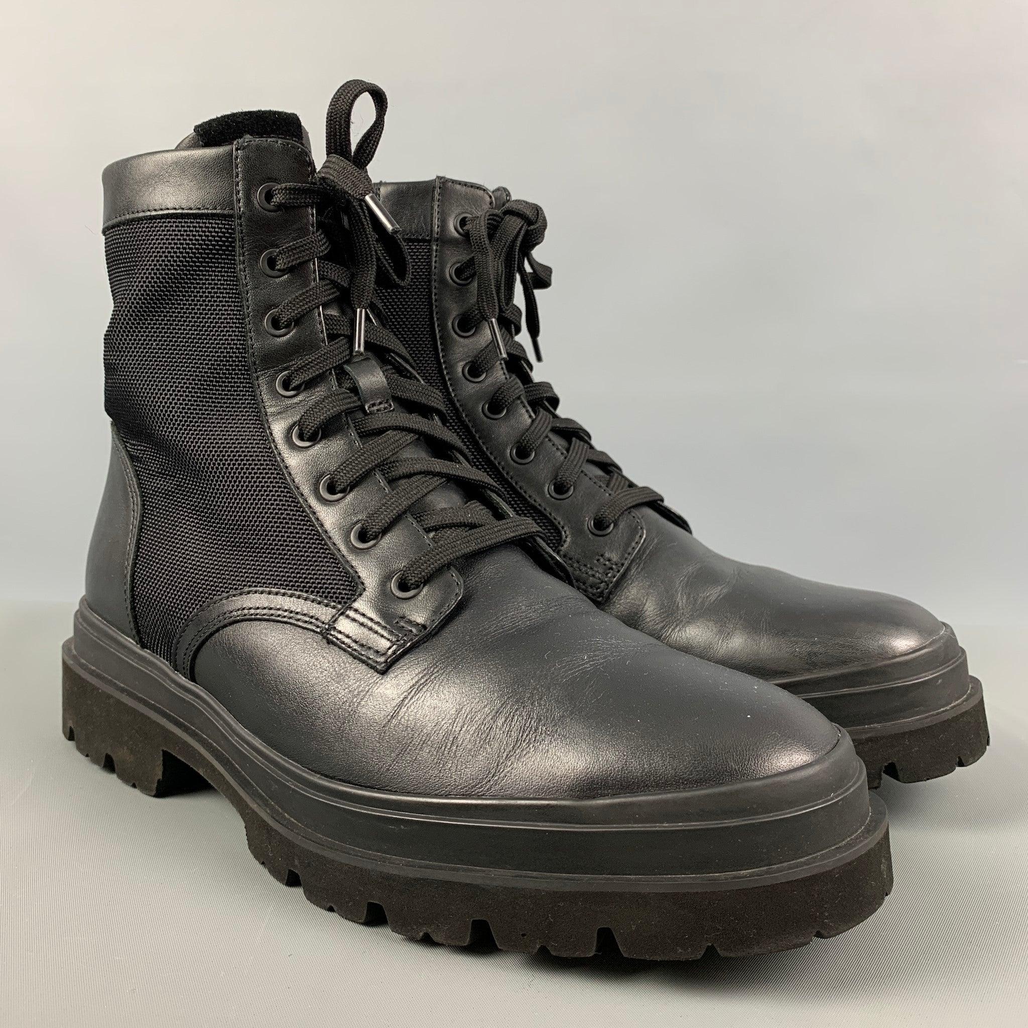 VINCE combat boots comes in a black mixed fabrics featuring a water repellent material, lace up, and thick sole. Excellent Pre-Owned Condition.  

Marked:   41 

Measurements: 
  Length: 12 inches Width: 4.5 inches Height: 8 inches  
  
  
