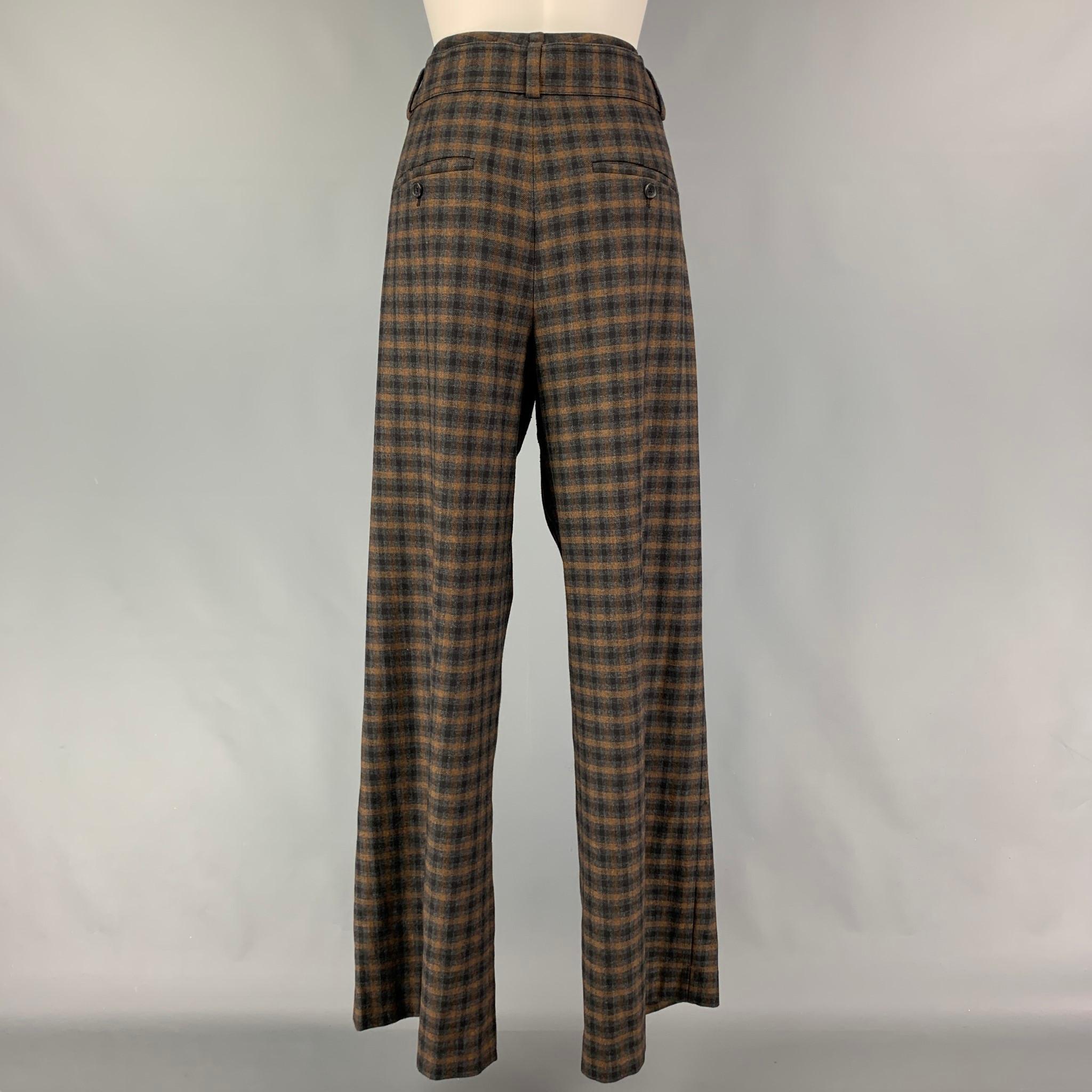 VINCE dress pants comes in a grey & brown plaid polyester blend featuring a wide leg, pleated, front tab, anda zip fly closure. 

Very Good Pre-Owned Condition.
Marked: 10

Measurements:

Waist: 32 in.
Rise: 13 in.
Inseam: 33 in. 