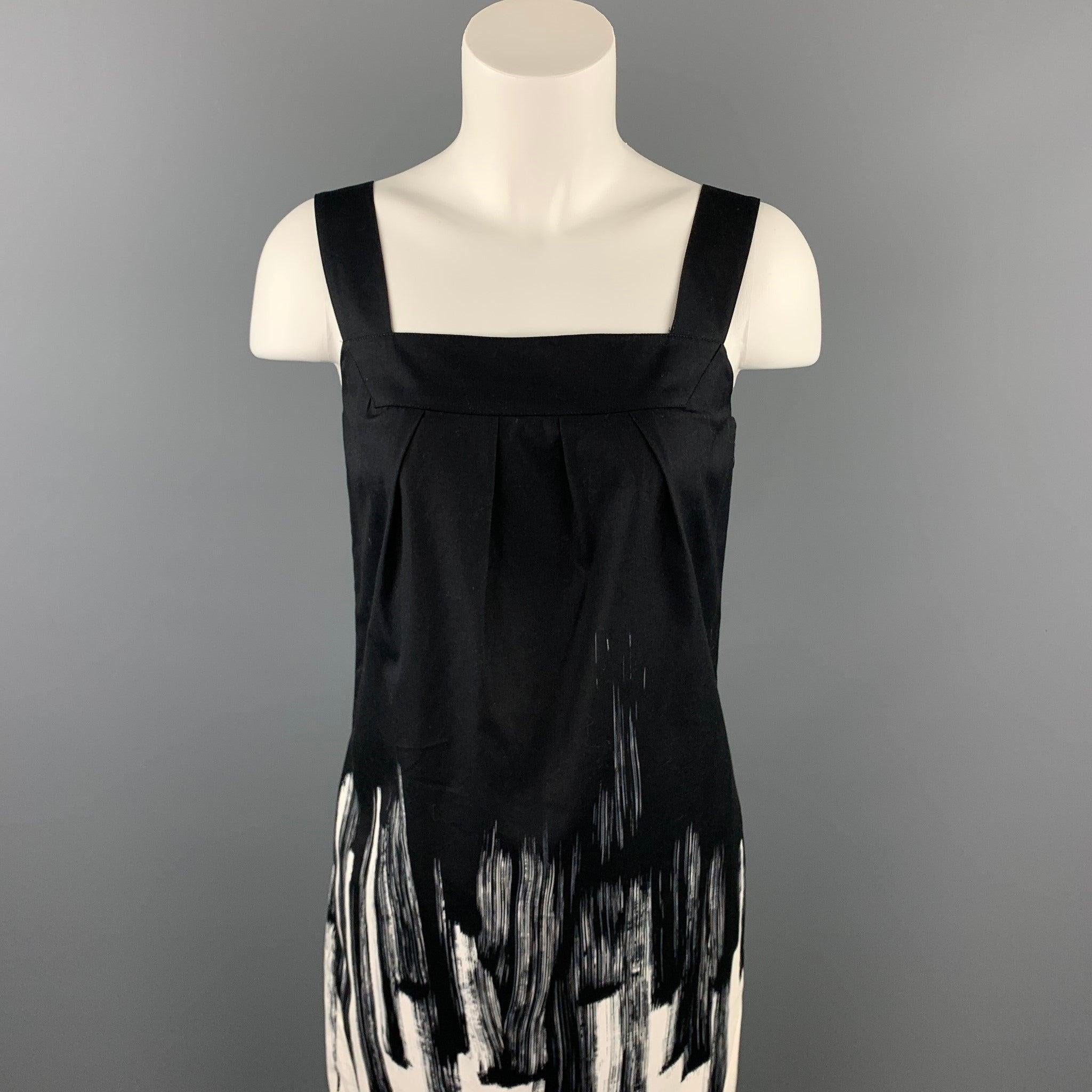 VINCE dress comes in a black & white color block cotton with a slip liner featuring a jumper style and a side zipper closure.Very Good
Pre-Owned Condition. 

Marked:   4 

Measurements: 
  
Bust: 31 inches 
Waist: 36 inches 
Hip: 38 inches 
Length: