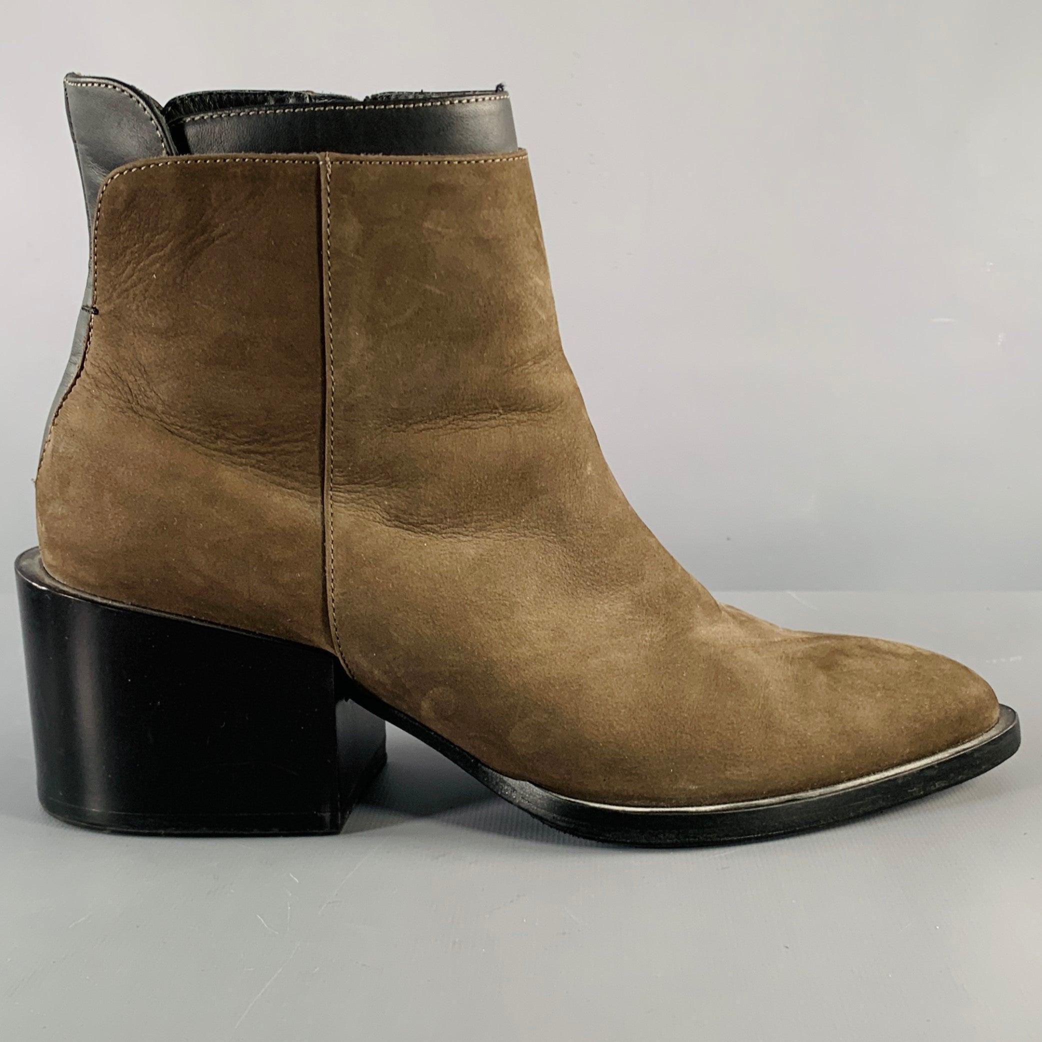 VINCE boots
in a brown suede fabric featuring grey leather trim, chunky heel, and side zipper closure.Very Good Pre-Owned Condition. Minor signs of wear. 

Marked:   38 

Measurements: 
  Length: 10.25 inches Width: 3.5 inches Height: 7.25 inches 
