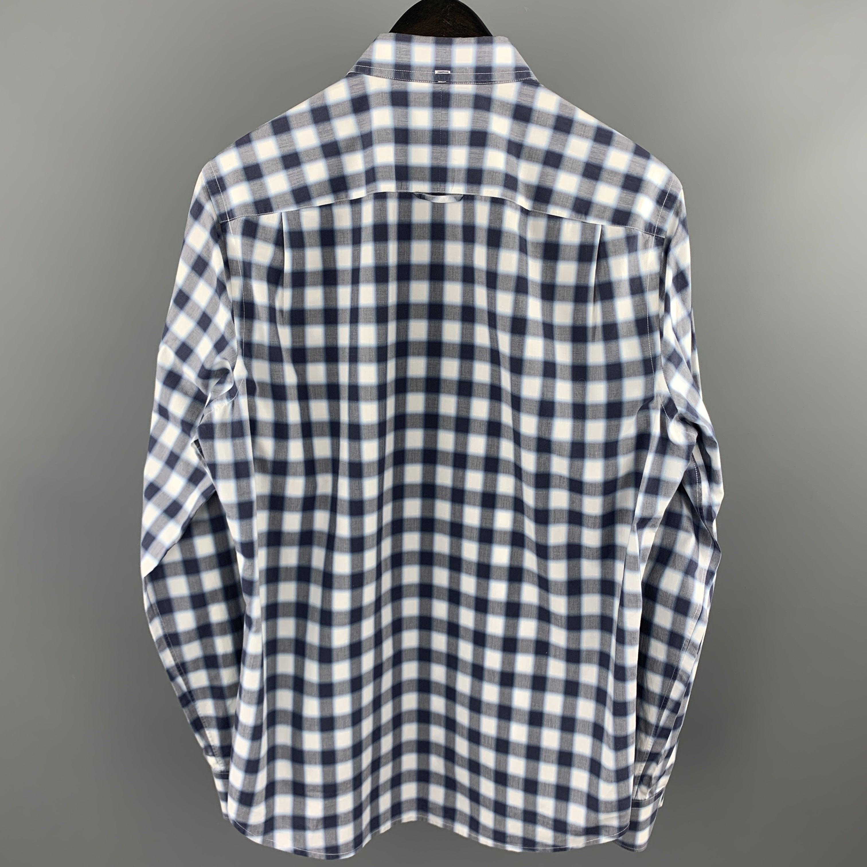 VINCE long sleeve shirt comes in a navy & gray plaid cotton featuring a button down style, contrast stitching, and a front patch pocket.
Excellent
Pre-Owned Condition. 

Marked:   M 

Measurements: 
 
Shoulder: 16 inches 
Chest: 41 inches 
Sleeve: