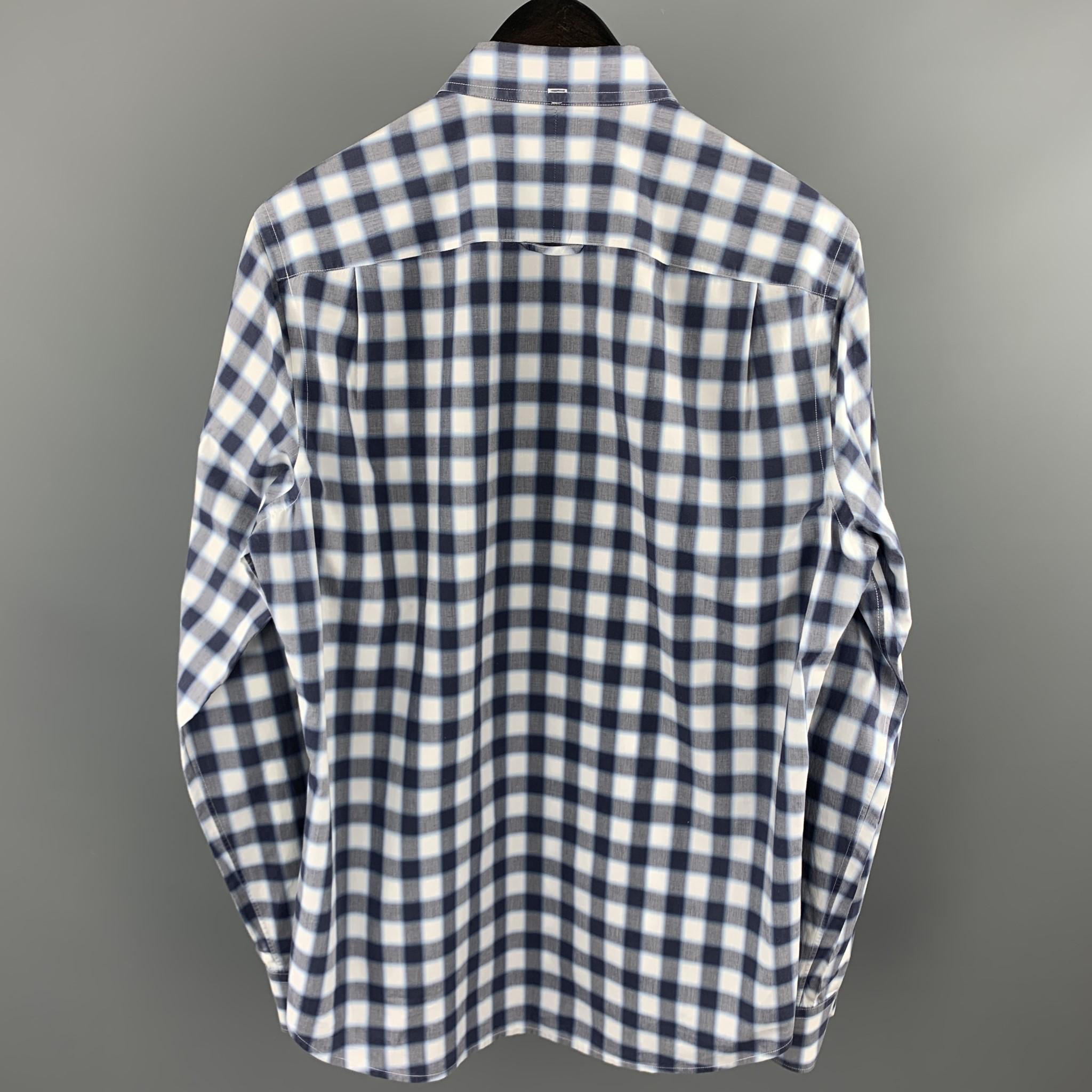 VINCE long sleeve shirt comes in a navy & gray plaid cotton featuring a button down style, contrast stitching, and a front patch pocket. 

Excellent Pre-Owned Condition.
Marked: M

Measurements:

Shoulder: 16 in. 
Chest: 41 in. 
Sleeve: 26.5 in.