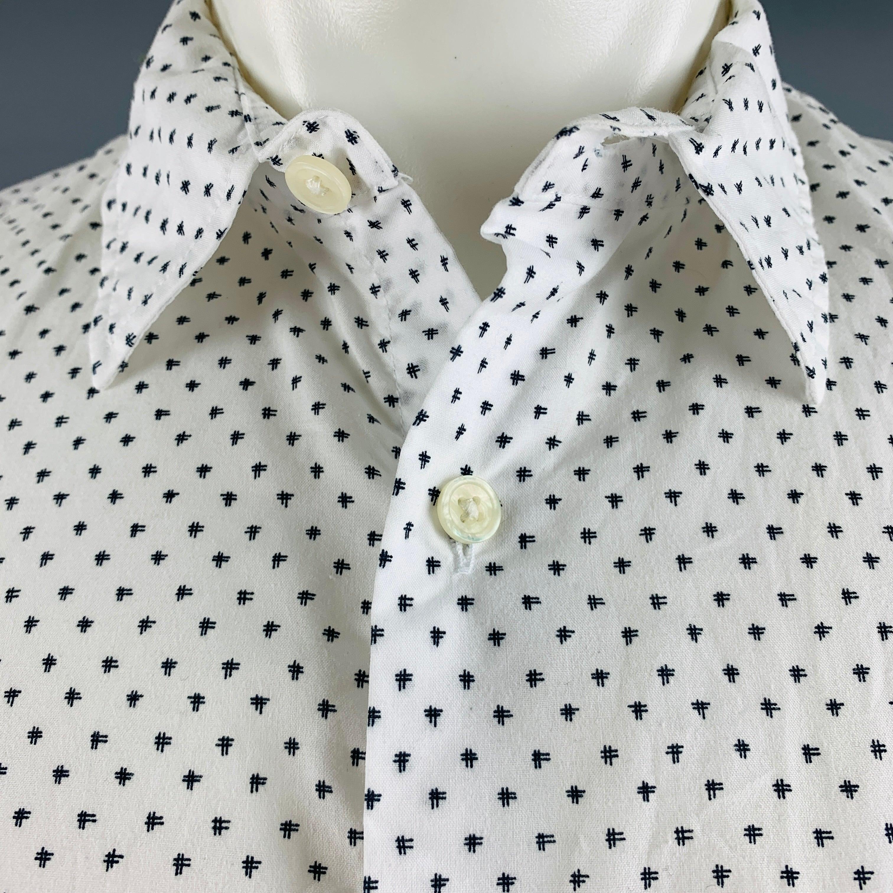 VINCE short sleeve shirt comes in a black and white abstract printed cotton blend woven material featuring one pocket, straight collar, classic fit, and button closure.Excellent Pre-Owned Condition. 

Marked:   M 

Measurements: 
 
Shoulder: 17
