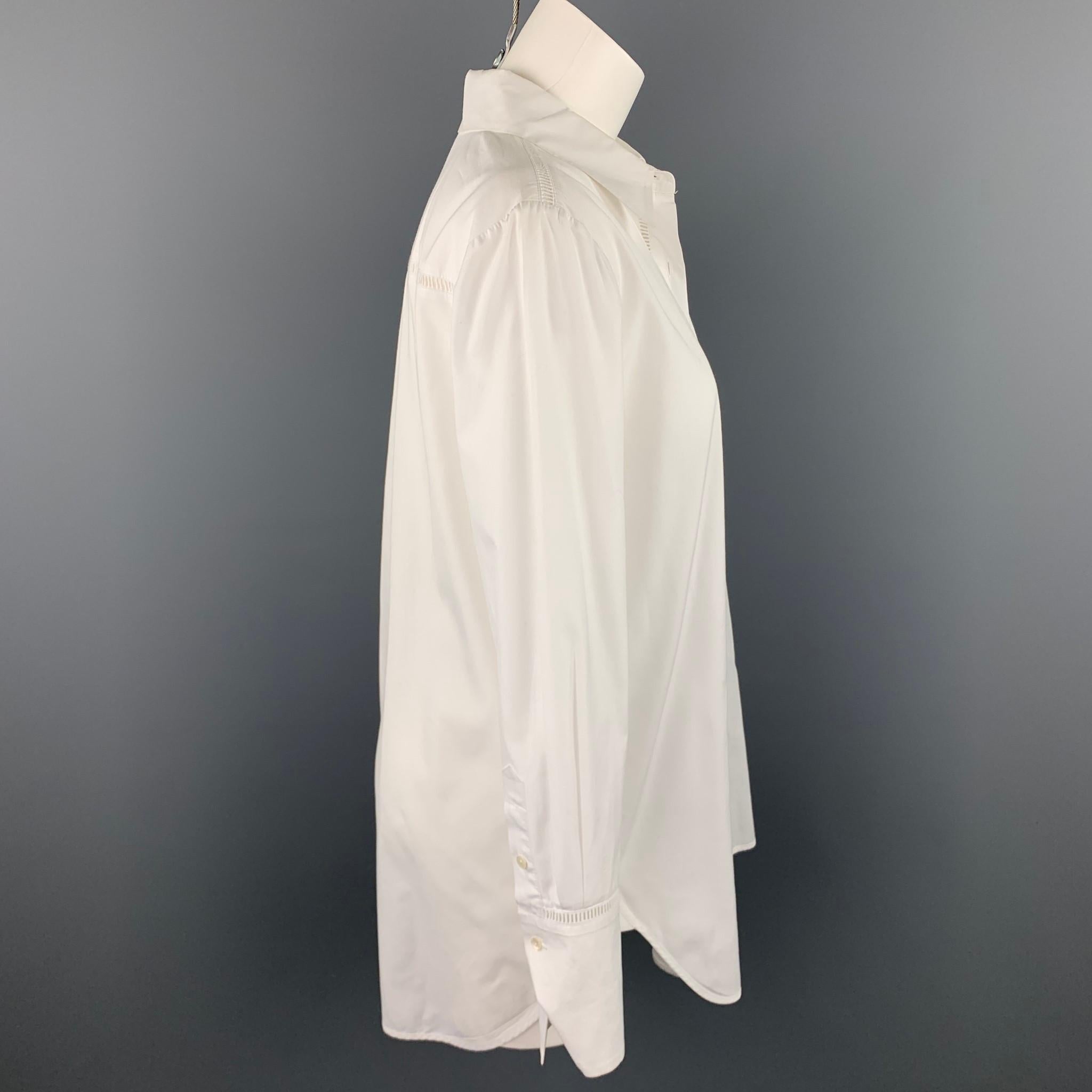 VINCE blouse comes in a white poplin cotton with eyelet details featuring a spread collar and a buttoned closure. 

Very Good Pre-Owned Condition.
Marked: M

Measurements:

Shoulder: 16 in. 
Bust: 42 in. 
Sleeve: 24.5 in. 
Length: 31.5 in. 

SKU: