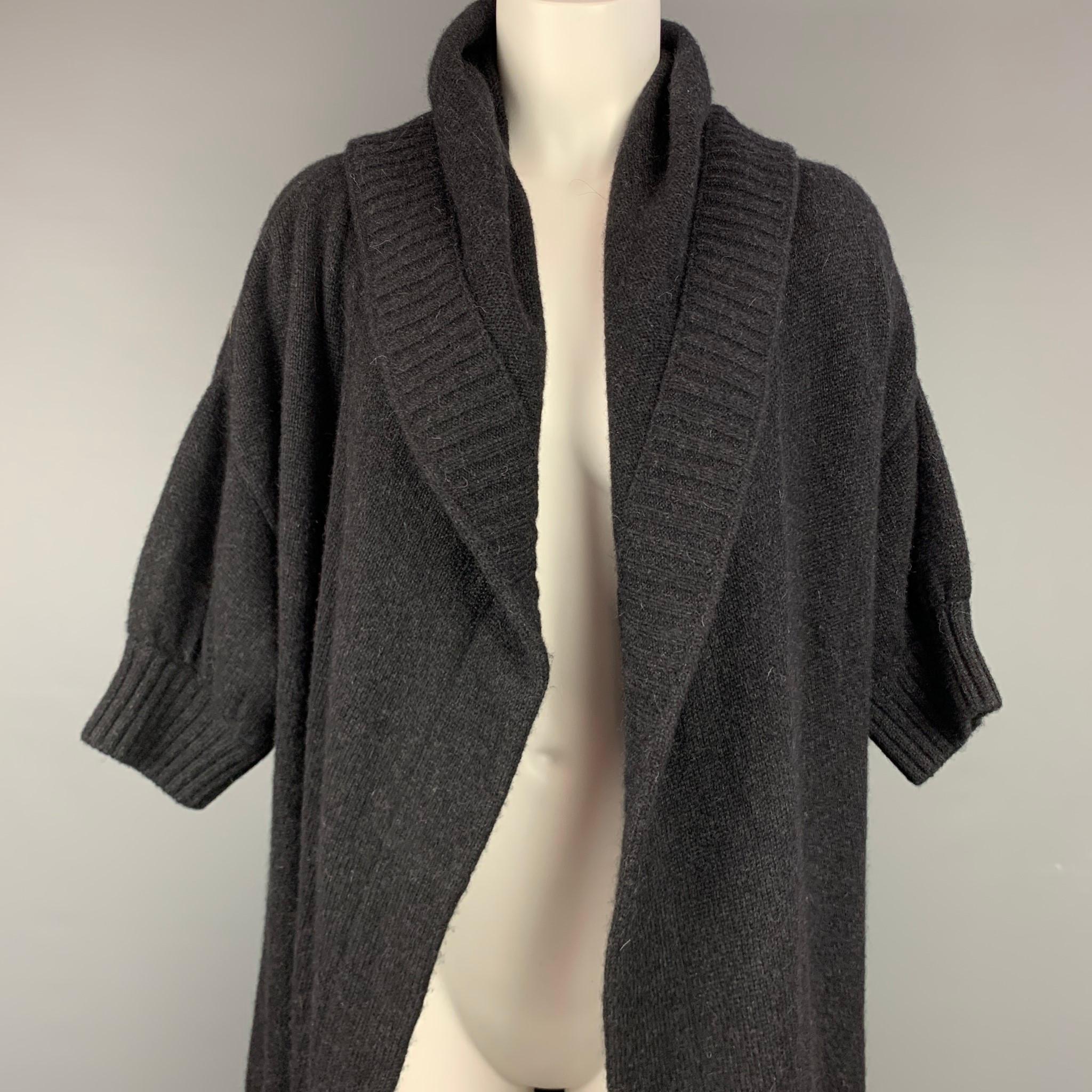 VINCE cardigan comes in a charcoal knitted alpaca blend featuring front pockets, hooded style, and a open front. 

Very Good Pre-Owned Condition.
Marked: S

Measurements:

Shoulder: 21 in.
Bust: 40 in.
Sleeve: 10 in.
Length: 30.5 in. 