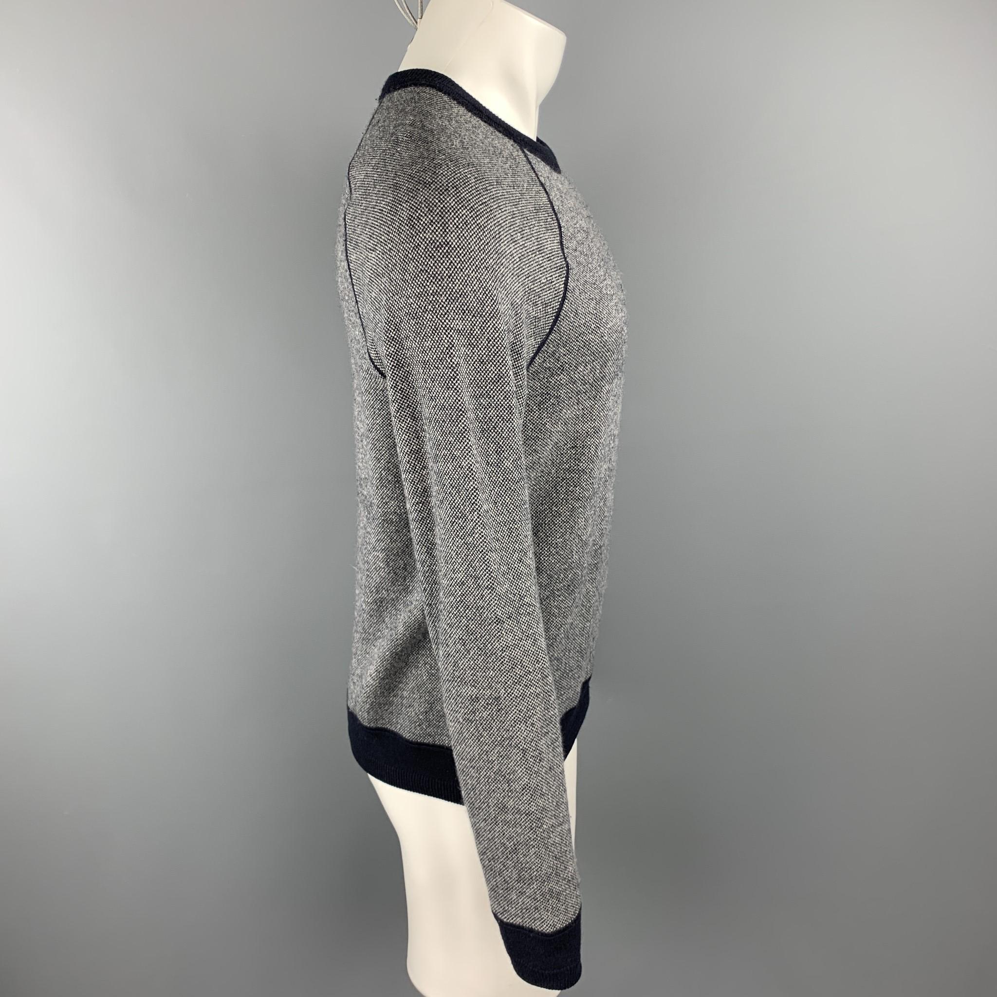VINCE pullover comes in a gray heather wool / cashmere with a navy trim featuring a raglan style and a crew-neck.

Excellent Pre-Owned Condition.
Marked: S/P

Measurements:

Shoulder: 16.5 in. 
Chest: 40 in. 
Sleeve: 27 in. 
Length: 25 in. 