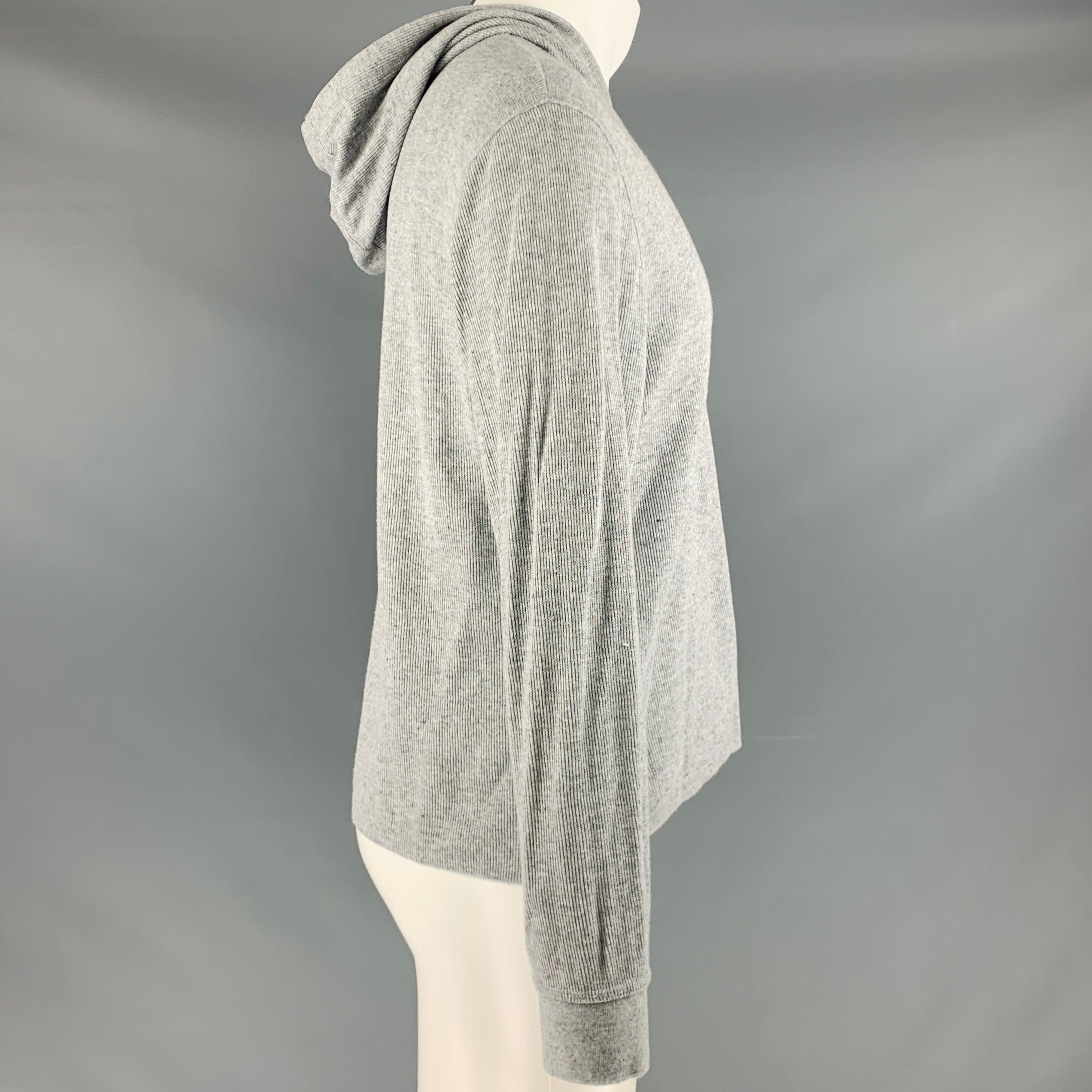 VINCE sweatshirt
in a grey coton blend fabric featuring a henley style with hood, textured knit, and half placket button closure.Excellent Pre-Owned Condition. 

Marked:   S 

Measurements: 
 
Shoulder: 19 inches Chest: 42 inches Sleeve: 24.5 inches