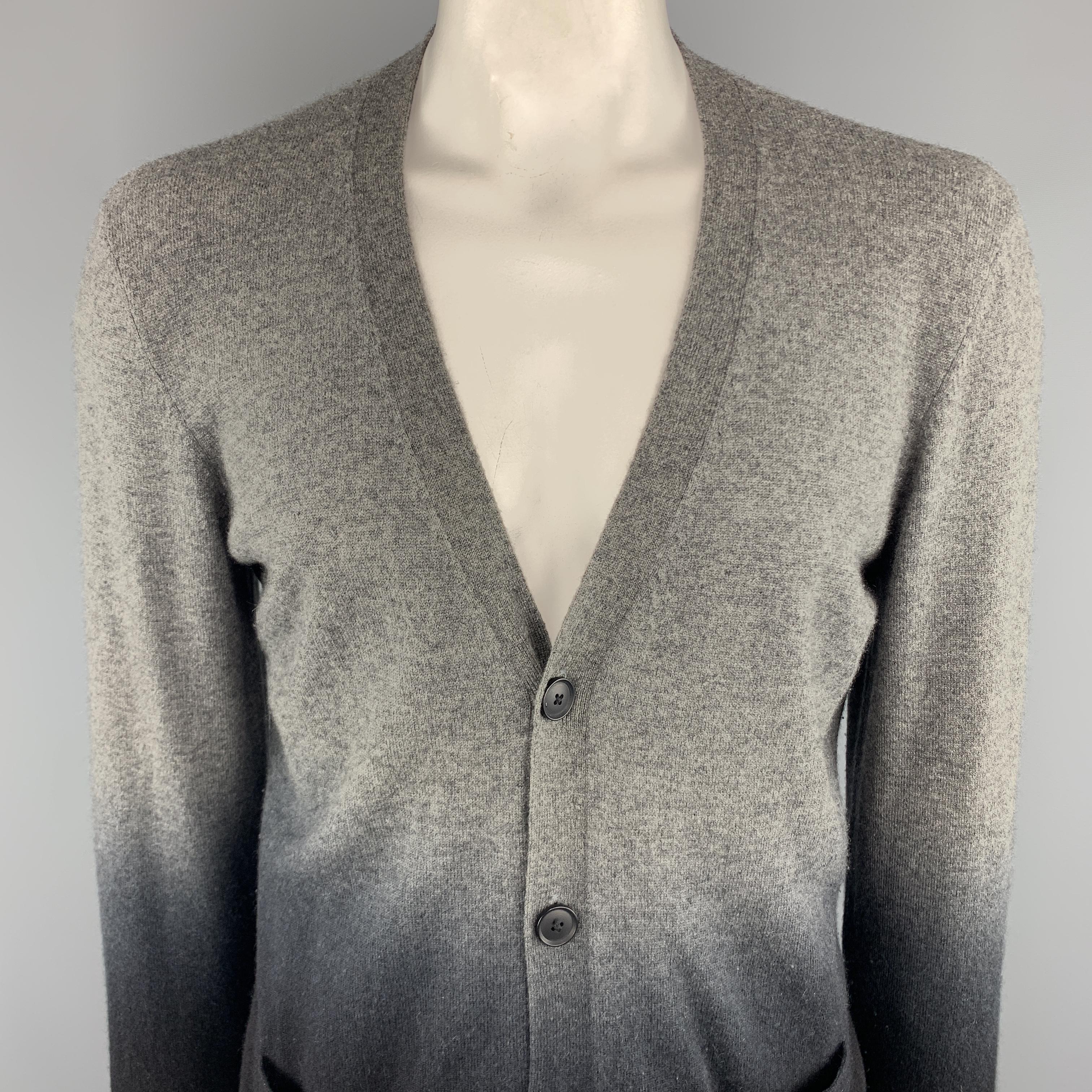 VINCE Cardigan Sweater comes in black and grey tones in an ombre cashmere  material, with a V-collar, long sleeves, front pockets, and ribbed cuffs and hem.
 
Very Good Pre-Owned Condition.
Marked: XL
 
Measurements:
 
Shoulder: 20 in.
Chest: 46