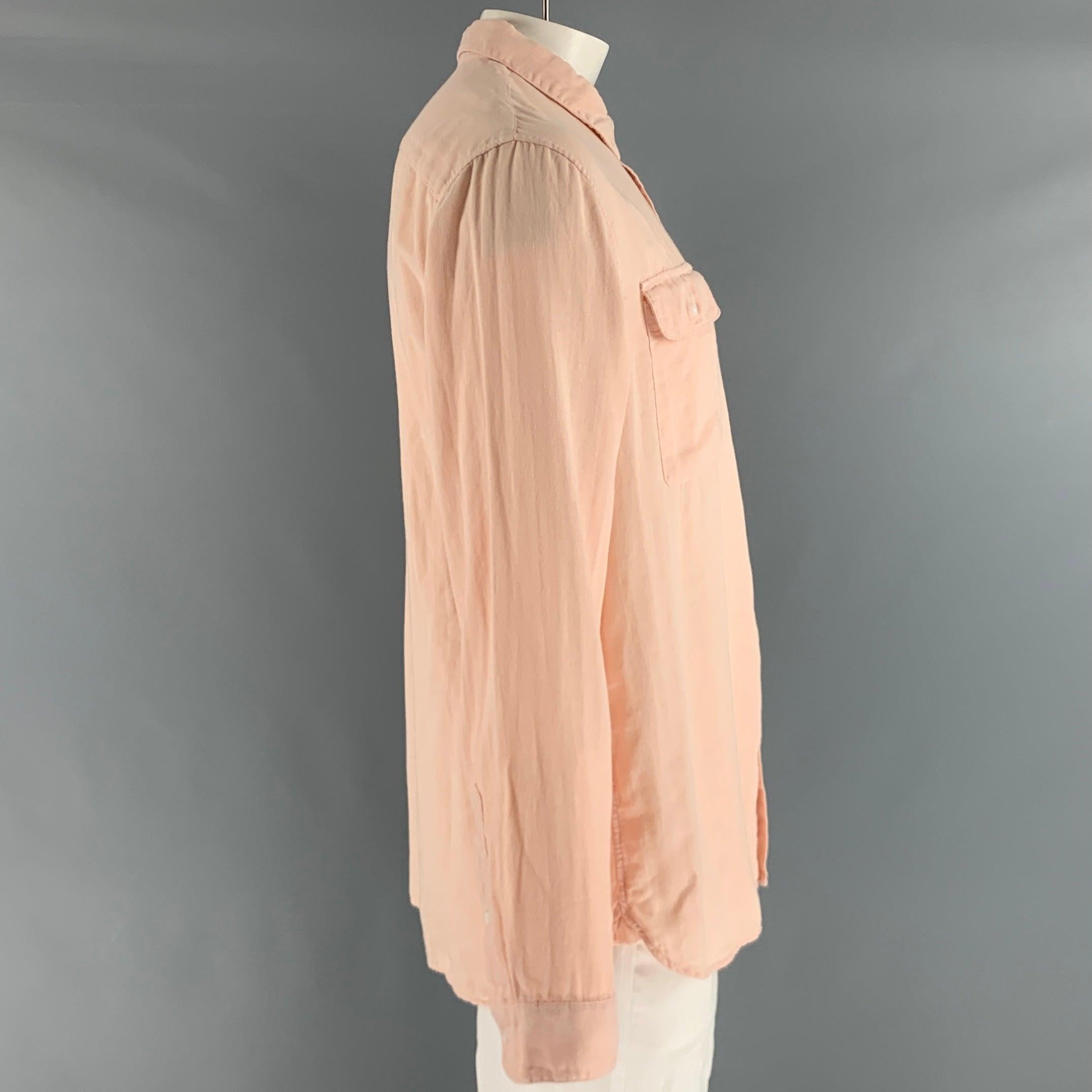 VINCE long sleeve shirt comes in an orange sorbet cotton woven material featuring a classic fit, patch pocket at front, and button closure.New with Tags. 

Marked:   XL 

Measurements: 
 
Shoulder: 19.5 inches Chest: 42 inches Sleeve: 27 inches