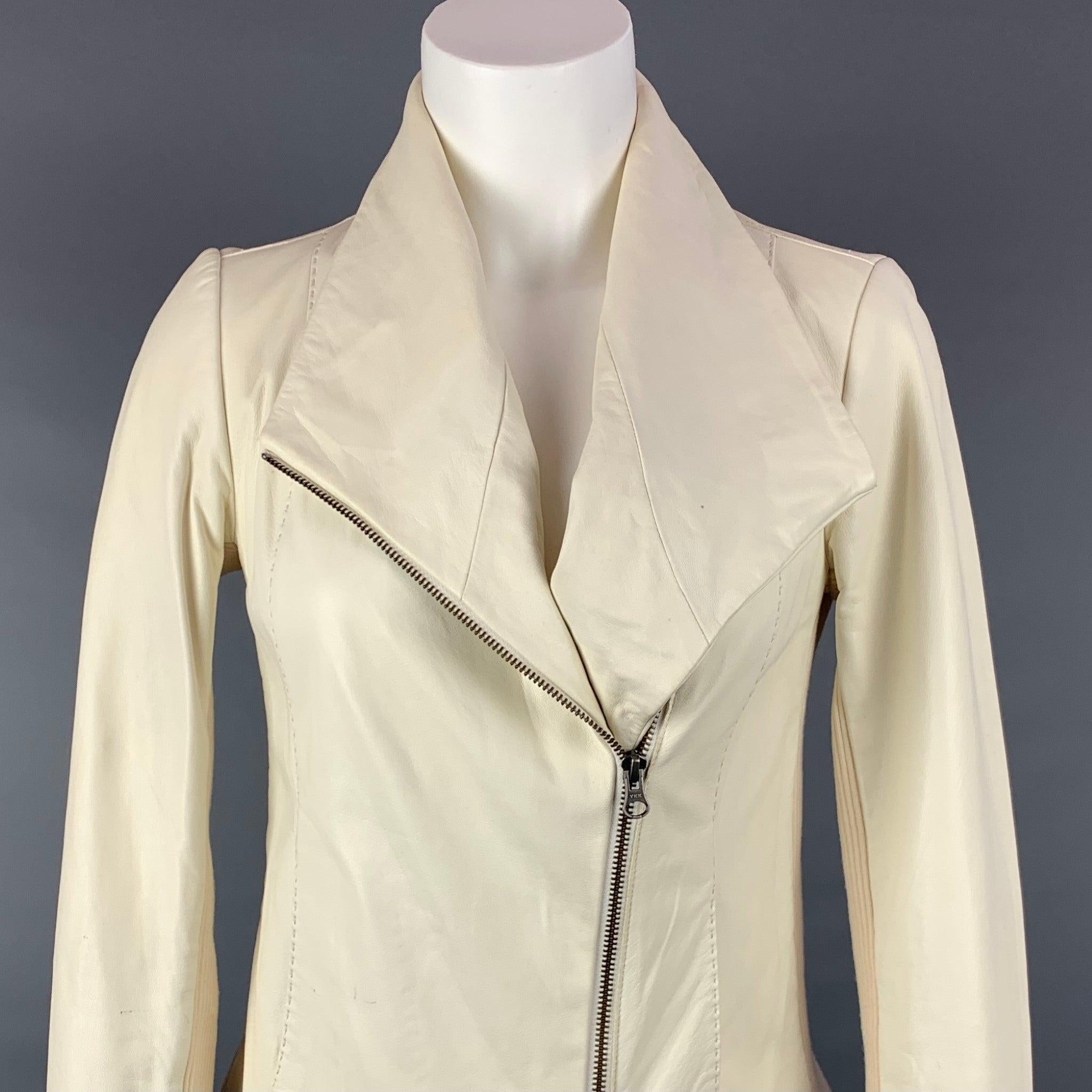 VINCE jacket comes in a cream leather with a stretch cotton panel featuring a motorcycle style, top stitching, slit pockets, and a zip up closure.
Very Good
Pre-Owned Condition. 

Marked:   XS 

Measurements: 
 
Shoulder: 14.5 inches  Bust: 32