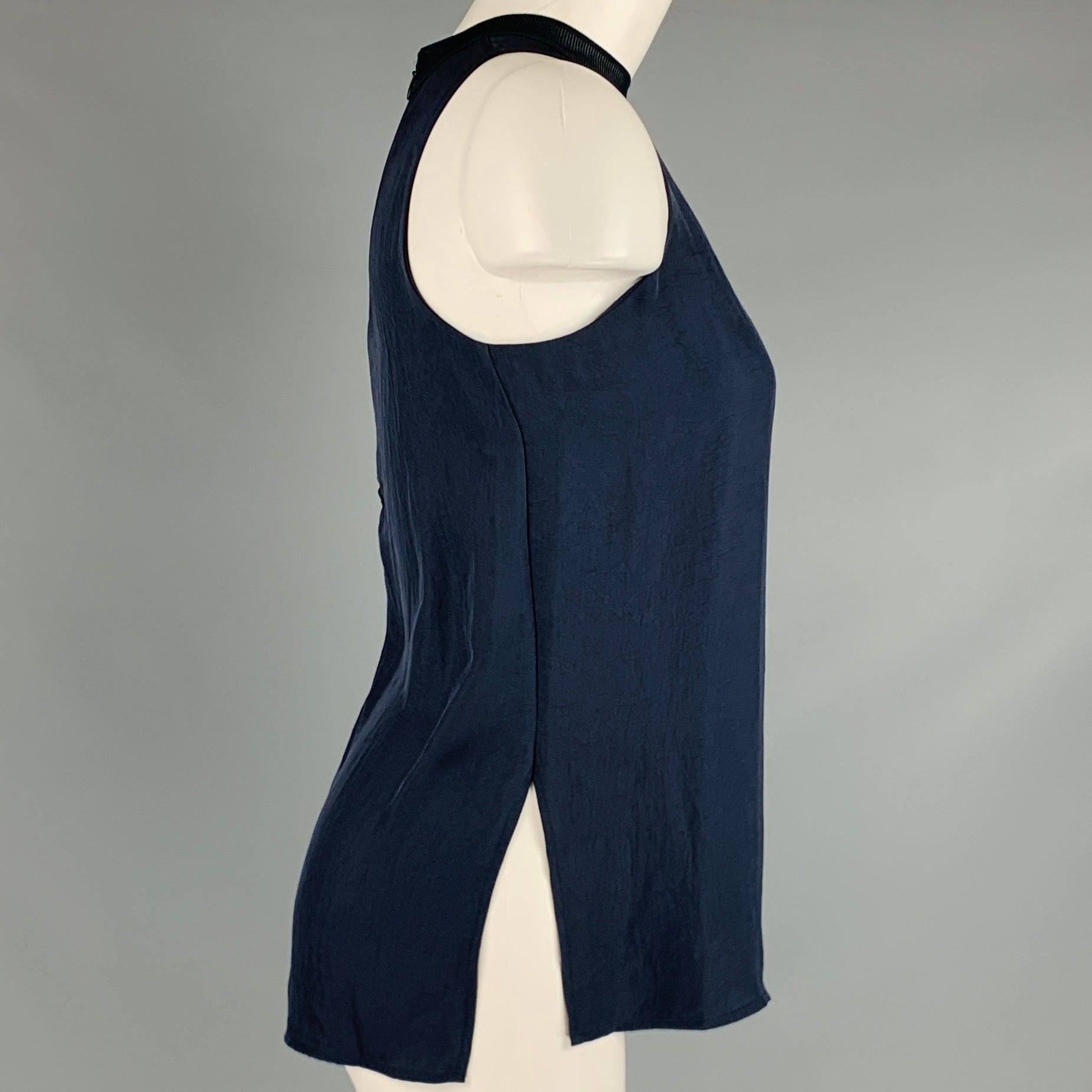 VINCE casual top
in a
charcoal grey rayon fabric featuring a sleeveless style, high neck, side slits, and back zipper closure.Excellent Pre-Owned Condition. 

Marked:   XS 

Measurements: 
  Bust: 32 inches Length: 24.5 inches 
  
  
 
Reference