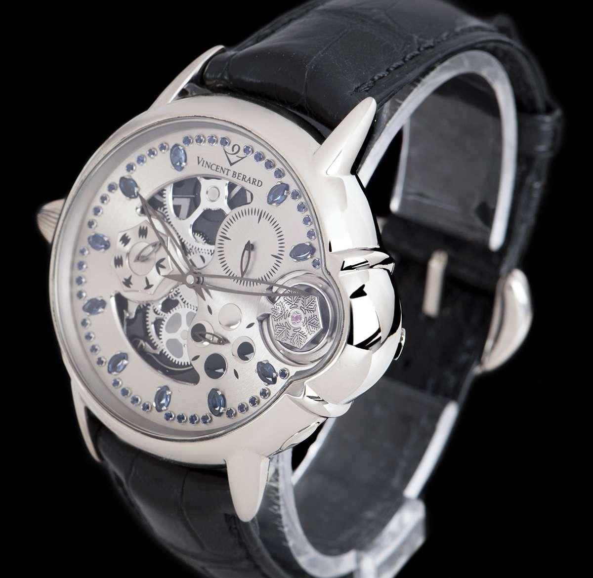 A Limited Edition 18k White Gold Balancier Mysterieux Left-Handed Gents Wristwatch LUV 4S, grey semi-skeleton dial set with 10 applied sapphire hour markers and applied minute markers, small seconds between 1 and 2 0'clock, balance wheel display at