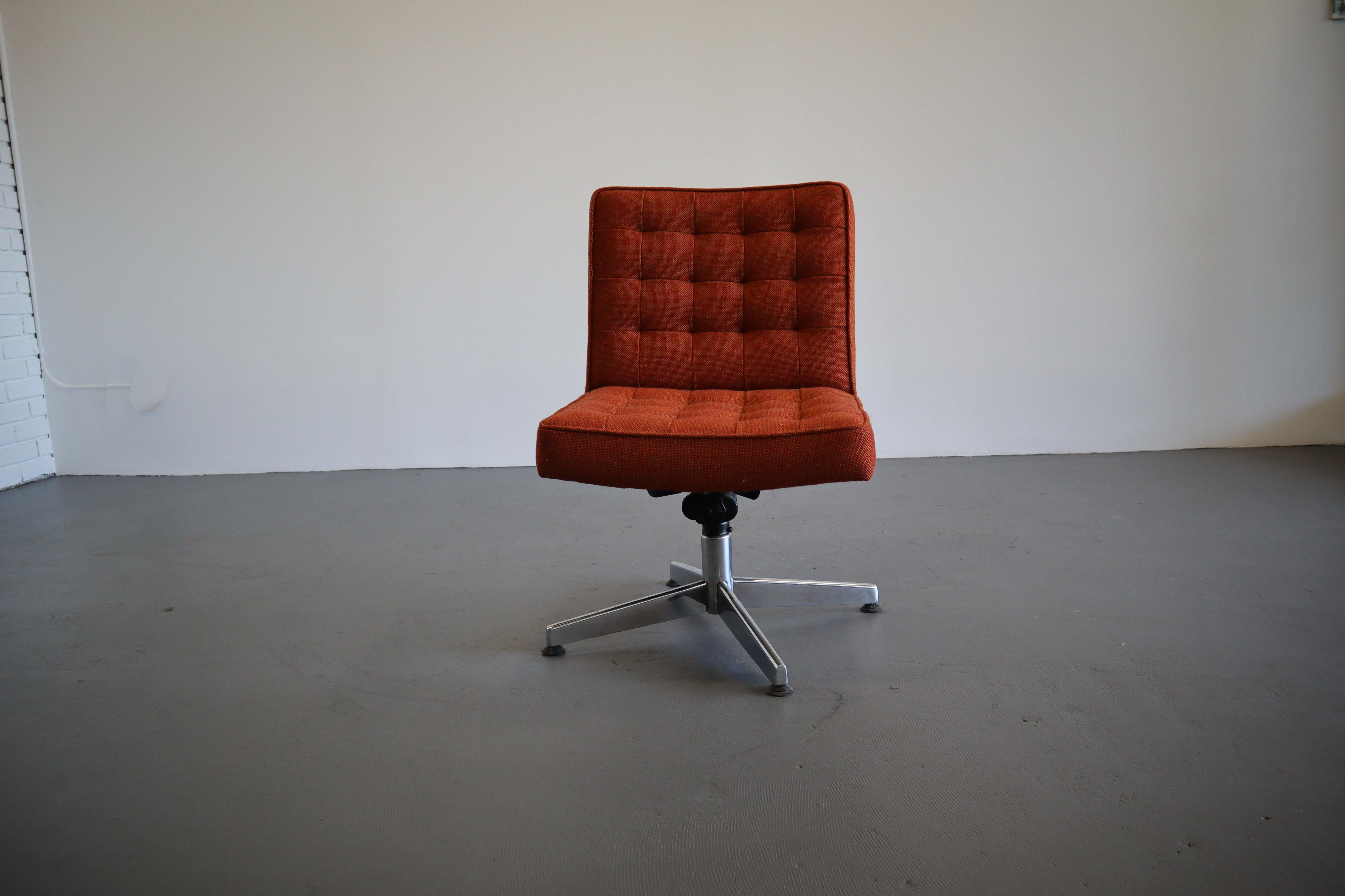 Brilliant amber color desk chair designed by Vincent Cafiero for Knoll. Clean lines, distinct tufted back, and four star base remains a classic design. Upholstery is a high performance Herman Miller fabric, simplistic and timeless Milnilo pattern