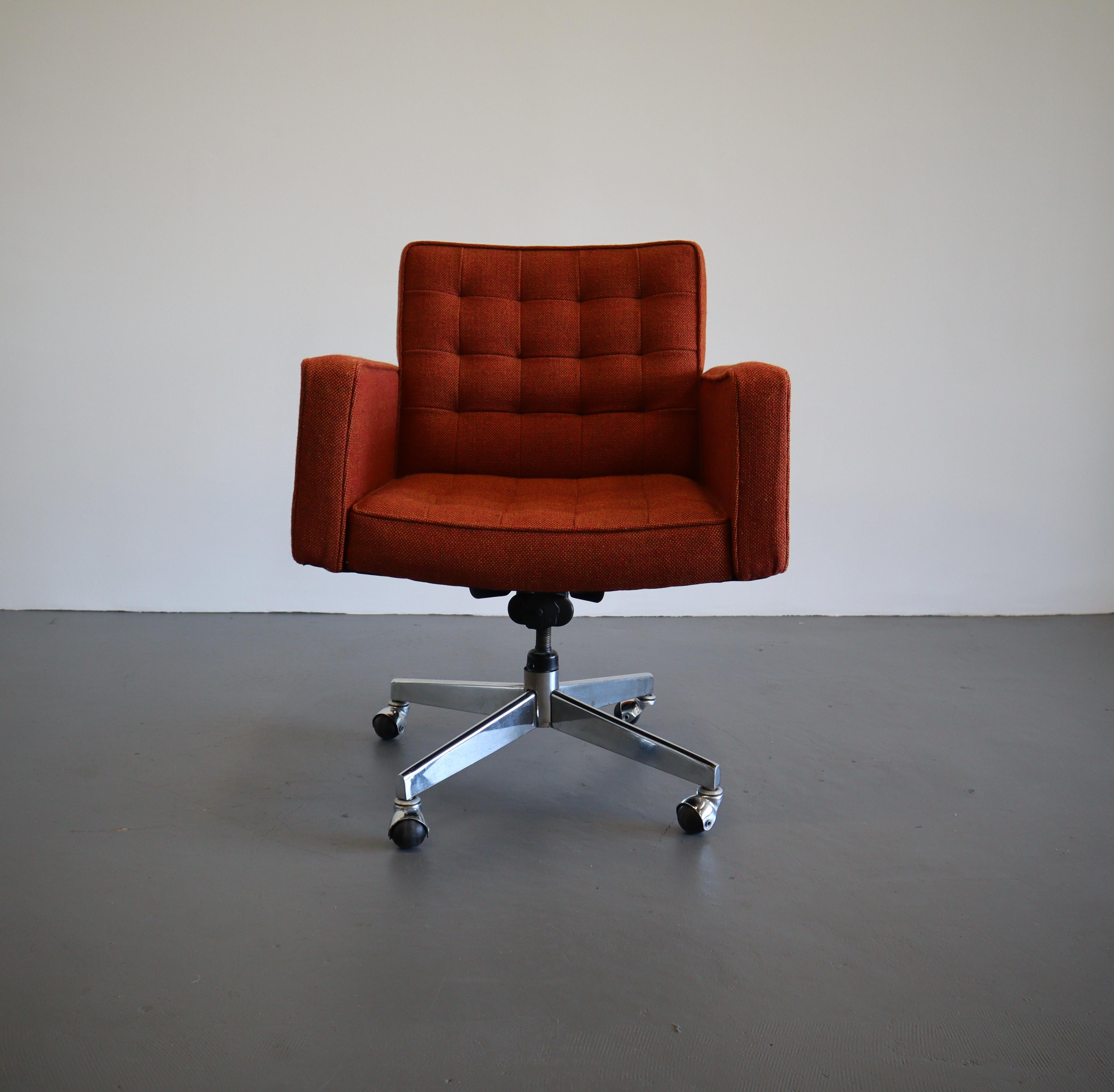 Brilliant amber color desk chair designed by Vincent Cafiero for Knoll. This low-back desk chair has distinct high profile armrests, a deep seat and four star caster base. The new upholstery is a high performance Herman Miller fabric, simplistic and