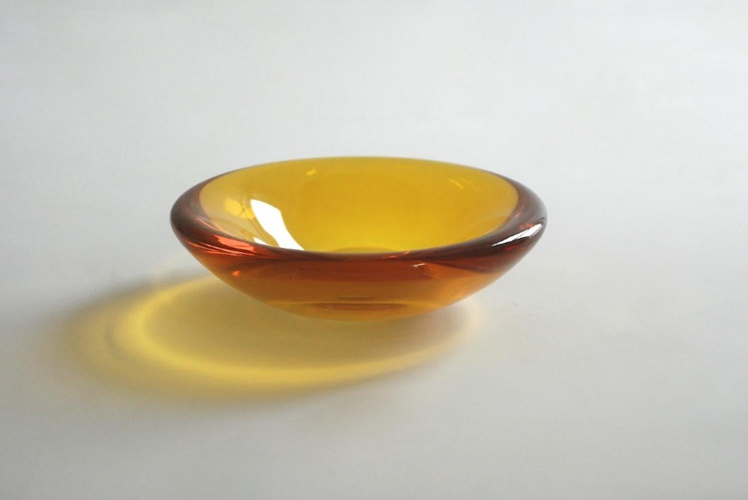 Epoxy guru Vincent de Rijk has made lustrous, shallow-bowls in a range of hypnotising colours and opacities. It's the perfect bowl to keep all life necessities.This Liquidish is aptly named honey, as it appears to be made of a solid version of the