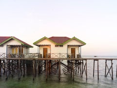 Borneo 1: stilt house architecture in water landscape at sunrise, Southeast Asia
