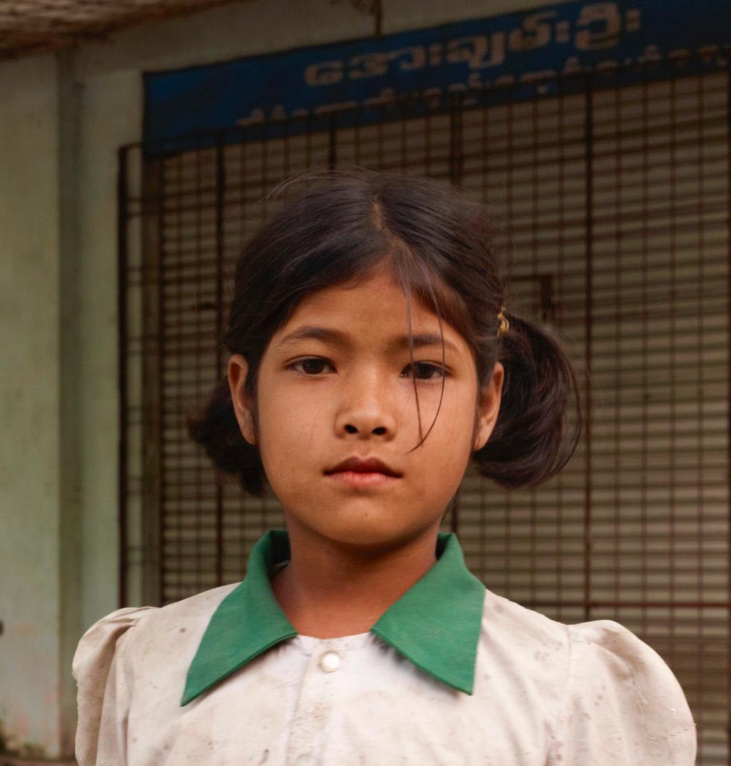 Myanmar 3: portrait photograph of young girl child in green, Southeast Asia - Photograph by Vincent Dixon