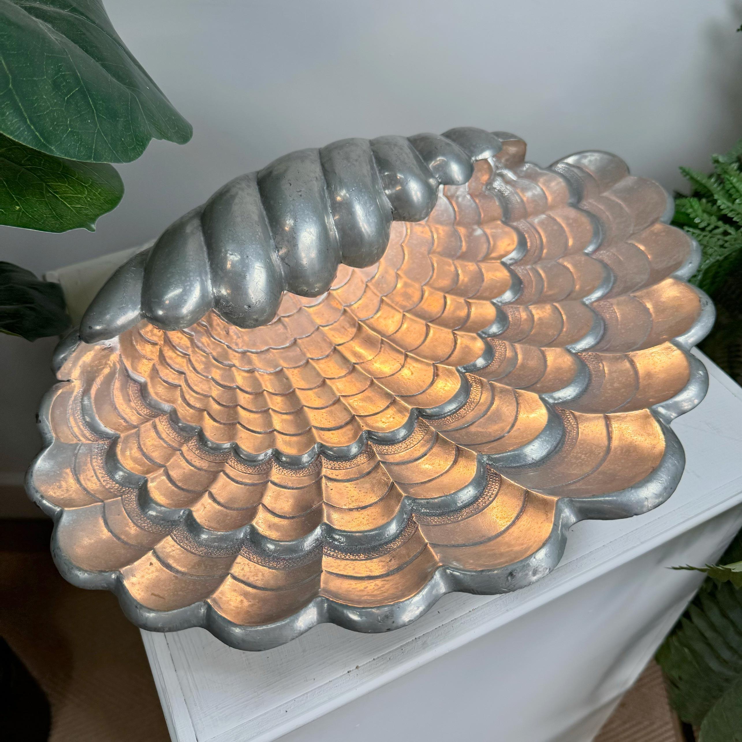 An exceptional and incredibly rare Pewter clam shell table lamp by Vincent Garinier, France, 1950’s  



This limited edition Shell Lamp was designed by the French artist Vincent Garnier, Paris and is hand signed by Garnier and numbered 228, stamped