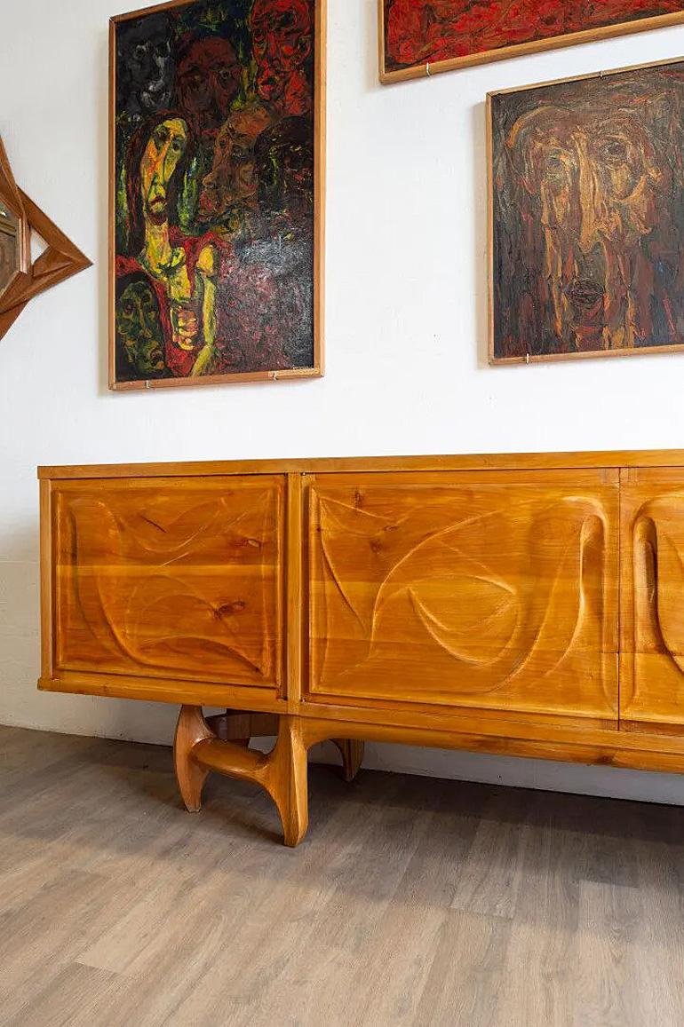 Vincent GONZALEZ (1928-2019)
Exceptional very large sideboard in carved wood opening with four doors circa 1960.
      