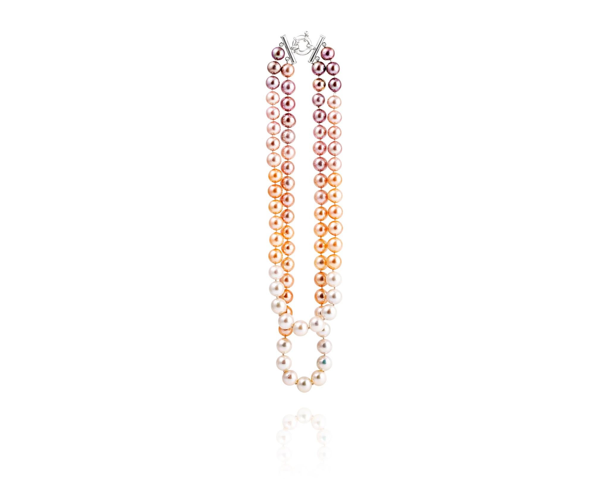 Part of the Vincent Peach Pearl Collection, the Double Ombre Edison Pearl Necklace features a weighty and luxurious strand of Freshwater and colorful Edison Pearls on a Double Line Necklace with a chunky Sterling Silver Clasp. The top strand of