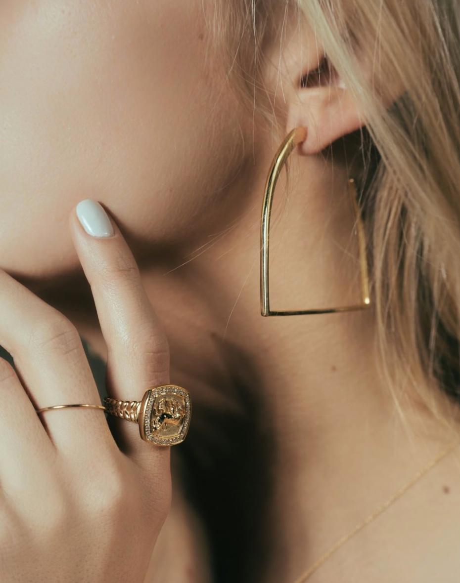 Part of the Vincent Peach Equestrian Collection, the Stirrup Hoop Earrings come in 14kt Yellow Gold and are 2