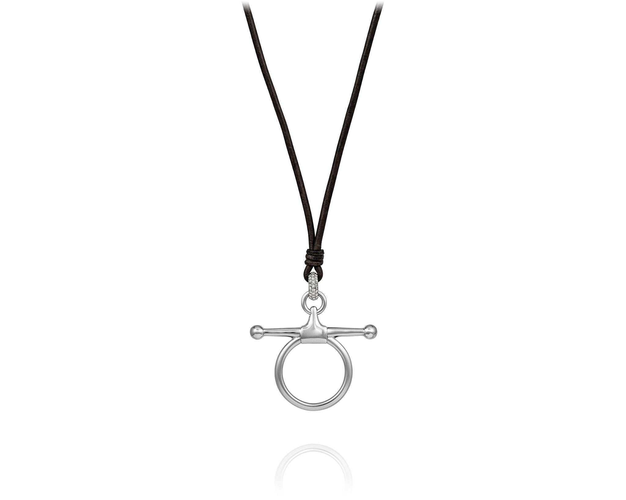 Part of the Vincent Peach Equestrian Collection, the Fulmer Bit Necklace has a Sterling Silver Snaffle Bit Design, set with .15ct Diamonds, on a Premium Brown Leather Cord with a Freshwater Pearl Clasp. Comes in 17