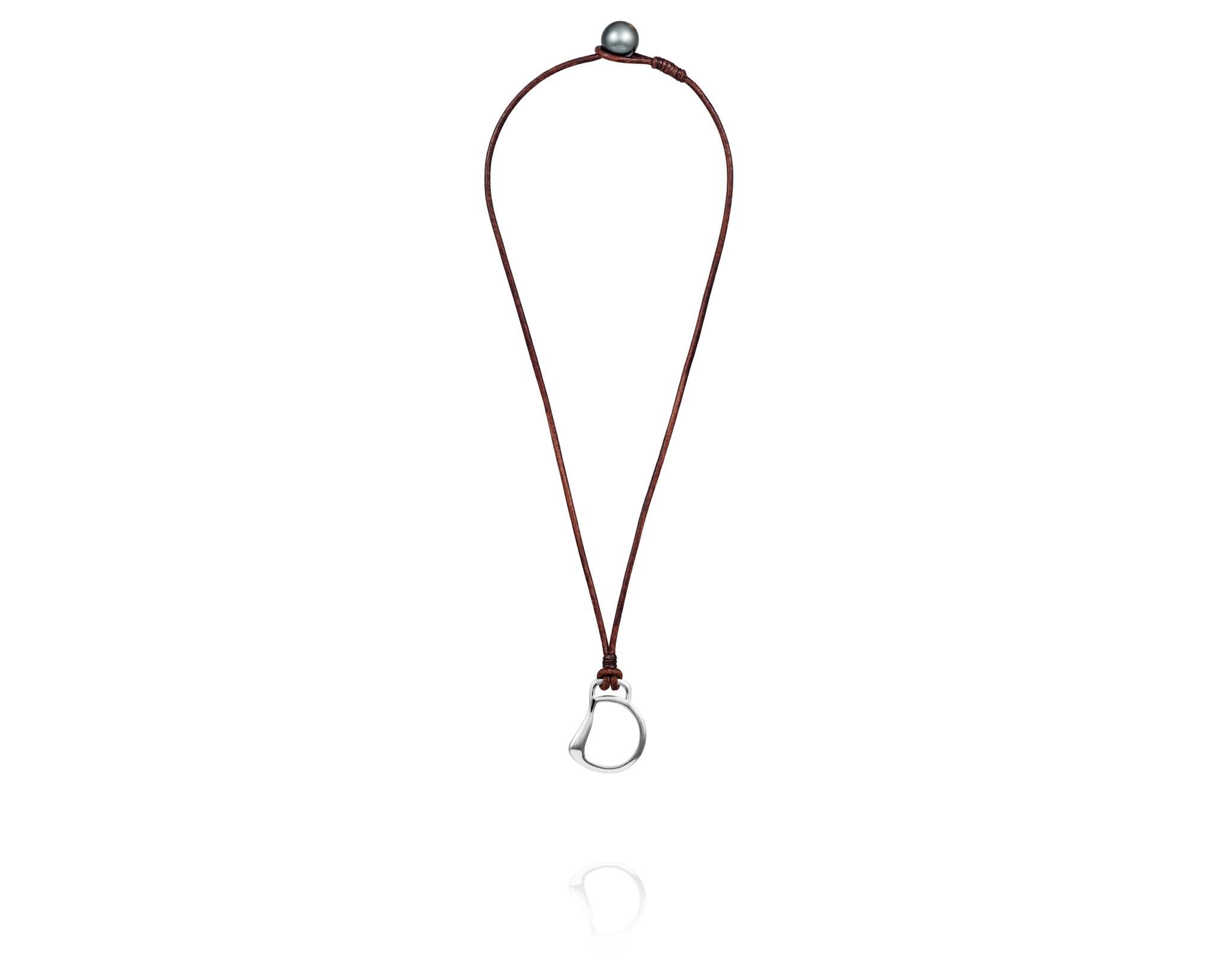 Part of the Vincent Peach Equestrian Collection, the Cheval Bit Necklace has a Sterling Silver Bit Design on a Premium Brown Leather Cord with a luxurious Tahitian Pearl Clasp. The Cheval Bit Necklace comes in the standard 17