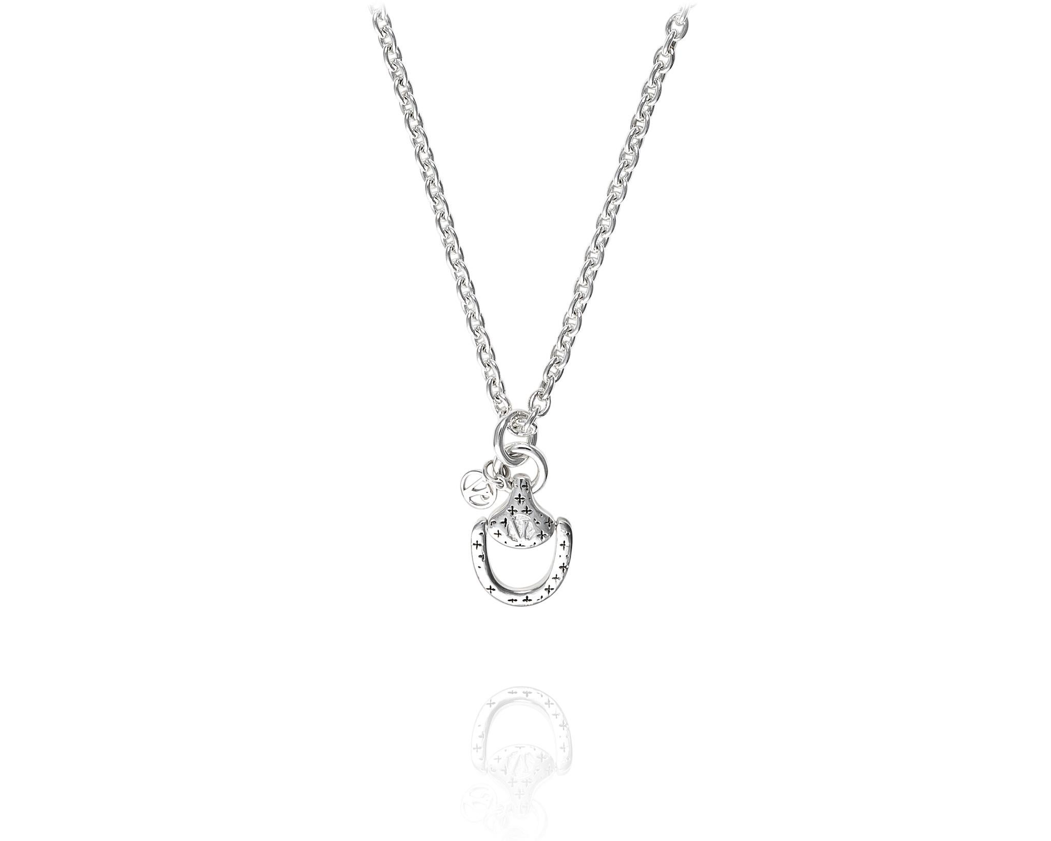 Part of the Vincent Peach Equestrian Collection, the original Churchill Downs Necklace has a Sterling Silver Chain with a Sterling Silver Bit, the signature VP design on the back, and a dangling VP Charm. This necklace comes in the Standard 17