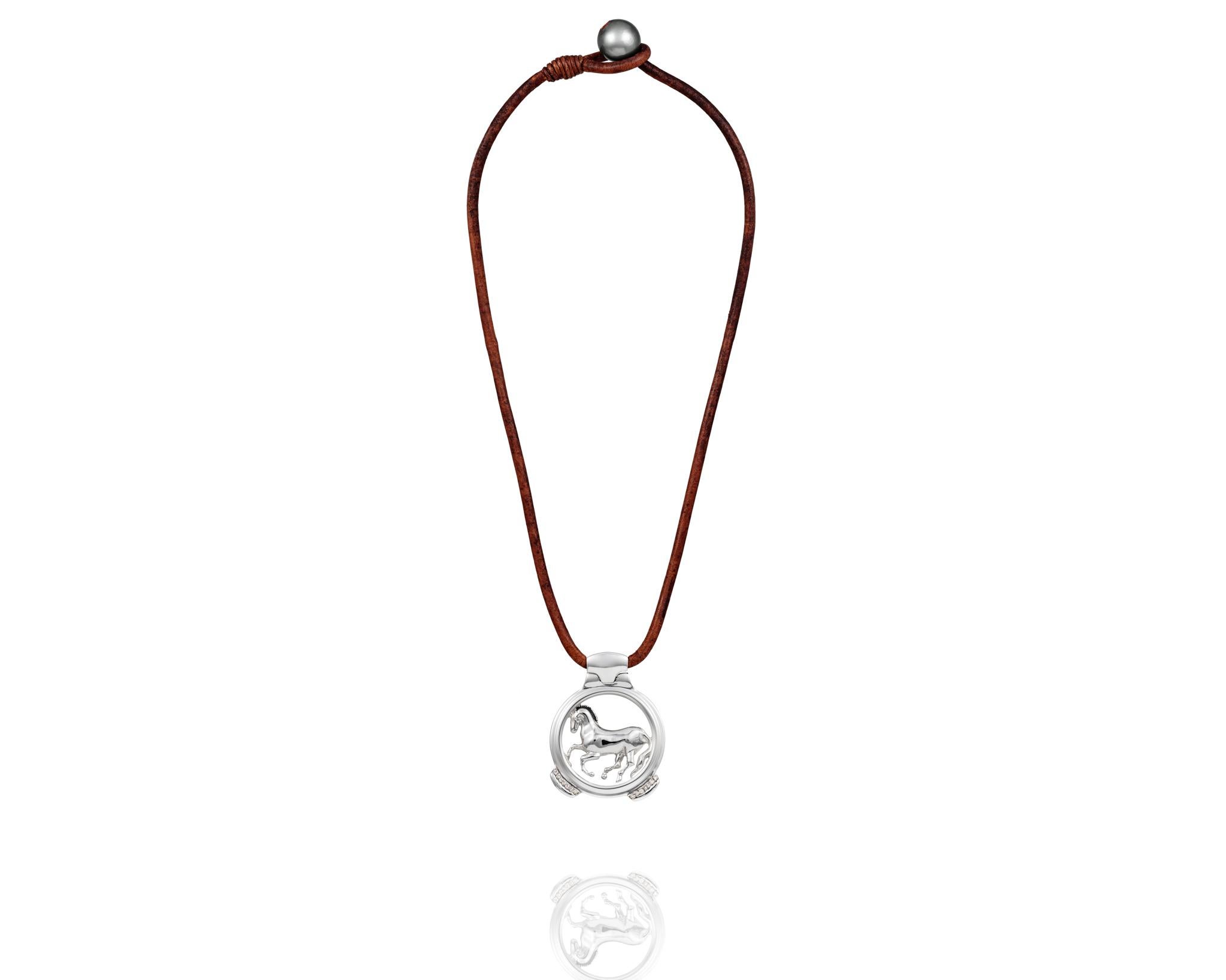 Part of the Vincent Peach Equestrian Collection, the Finnhorse Necklace has our signature Sterling Silver Horse Pendant on a Premium Leather Cord with a Luxurious Tahitian Pearl Clasp. This necklace comes in the Standard 17