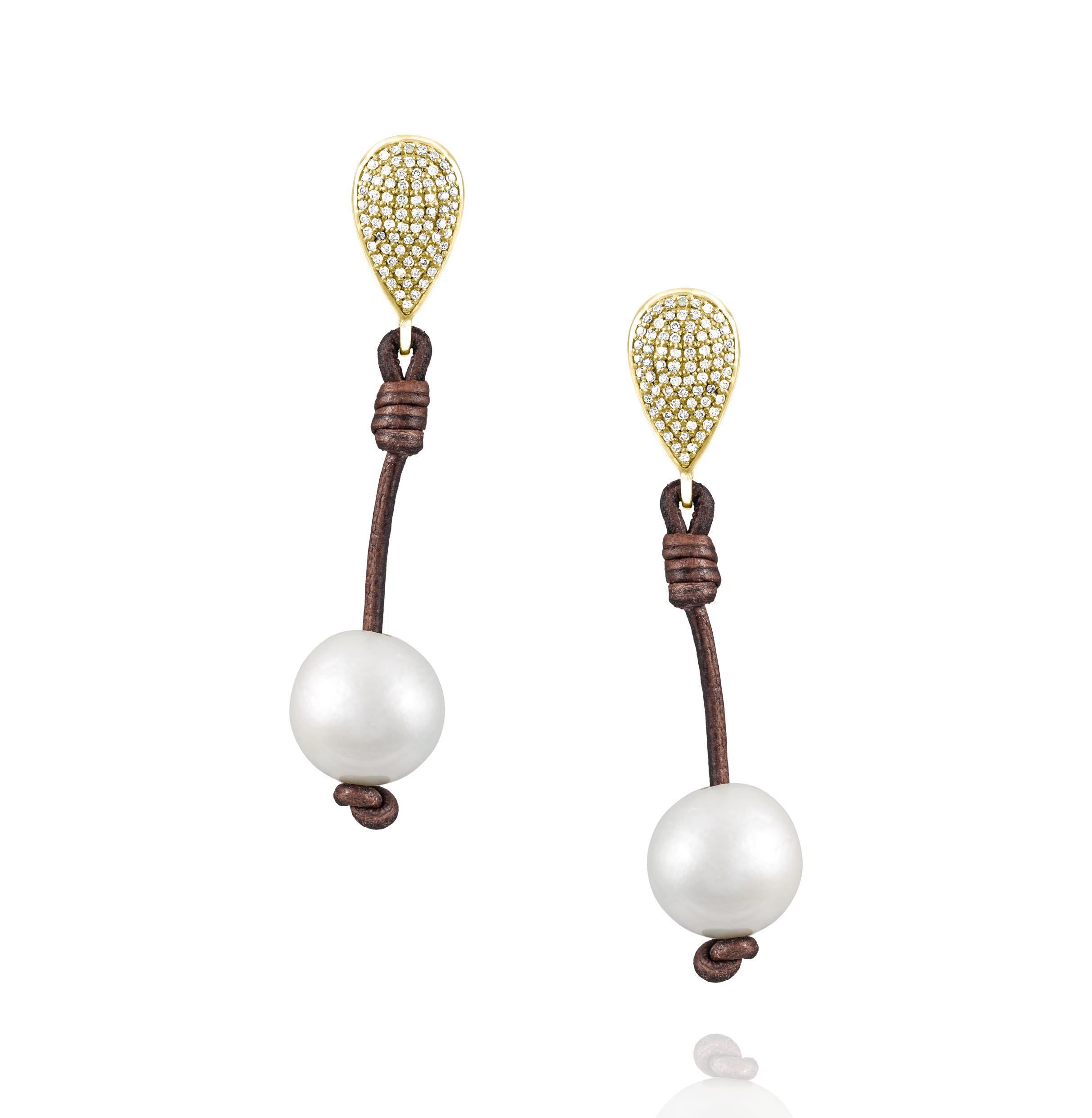 Part of the signature, Vincent Peach Pearl Collection, the Demure Teardrop Earrings feature luxurious,  13mm Tahitian Pearls on Premium Leather Cords with 3.28ct Diamonds mounted in a 14kt Yellow Gold post. These earrings have 14k Yellow Gold Backs