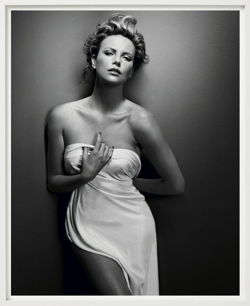 This stunning black-and-white portrait of Charlize Theron, captured by Vincent Peters in 2008, is a masterful blend of classic Hollywood glamour and modern sensuality.

All prints are limited edition. Available in multiple sizes. High-end framing on