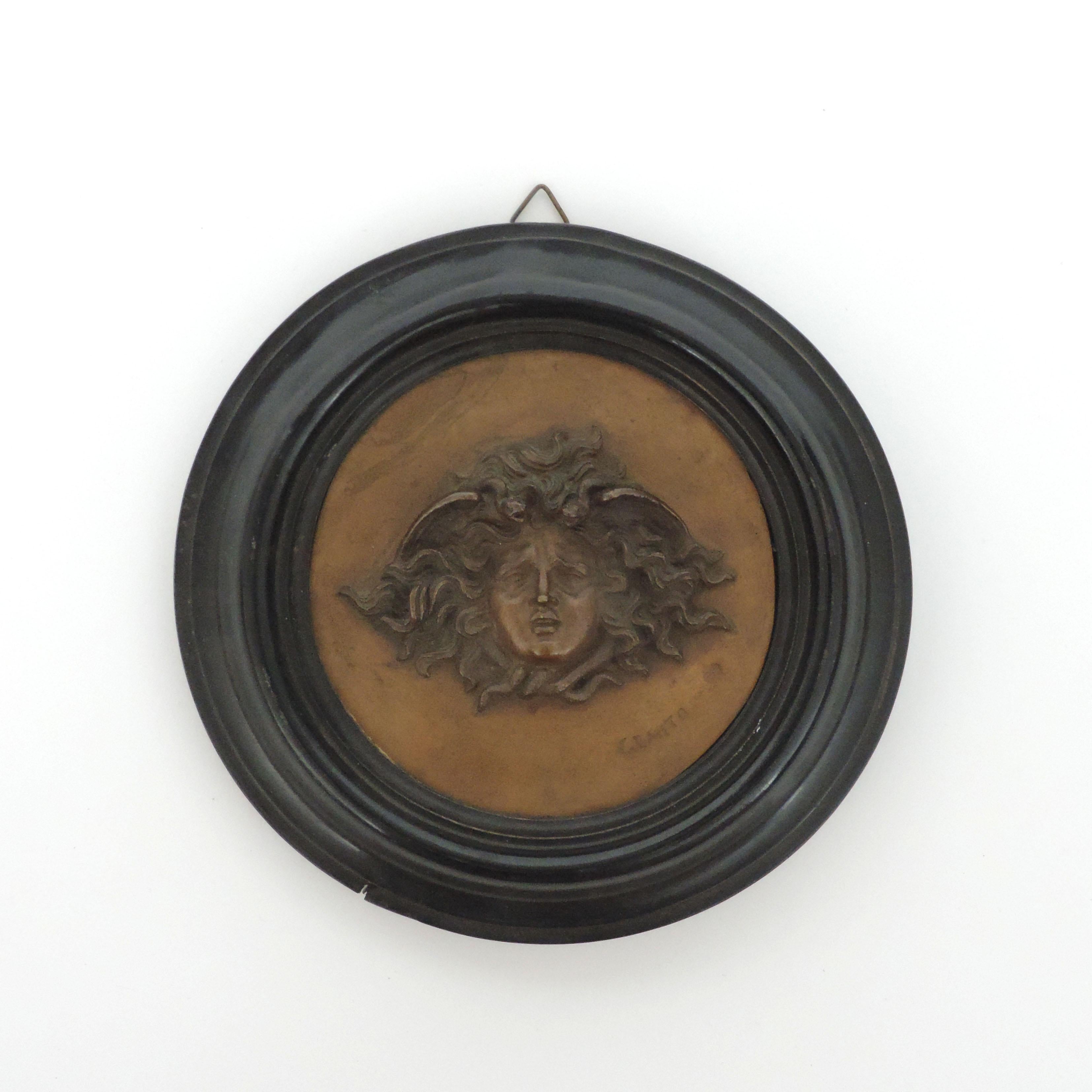 Vincenzo Gemito bronze roundel with the medusa head, Italy 1910.
Signed Gemito and Fonderia Gemito Napoli.
In a wooden frame.